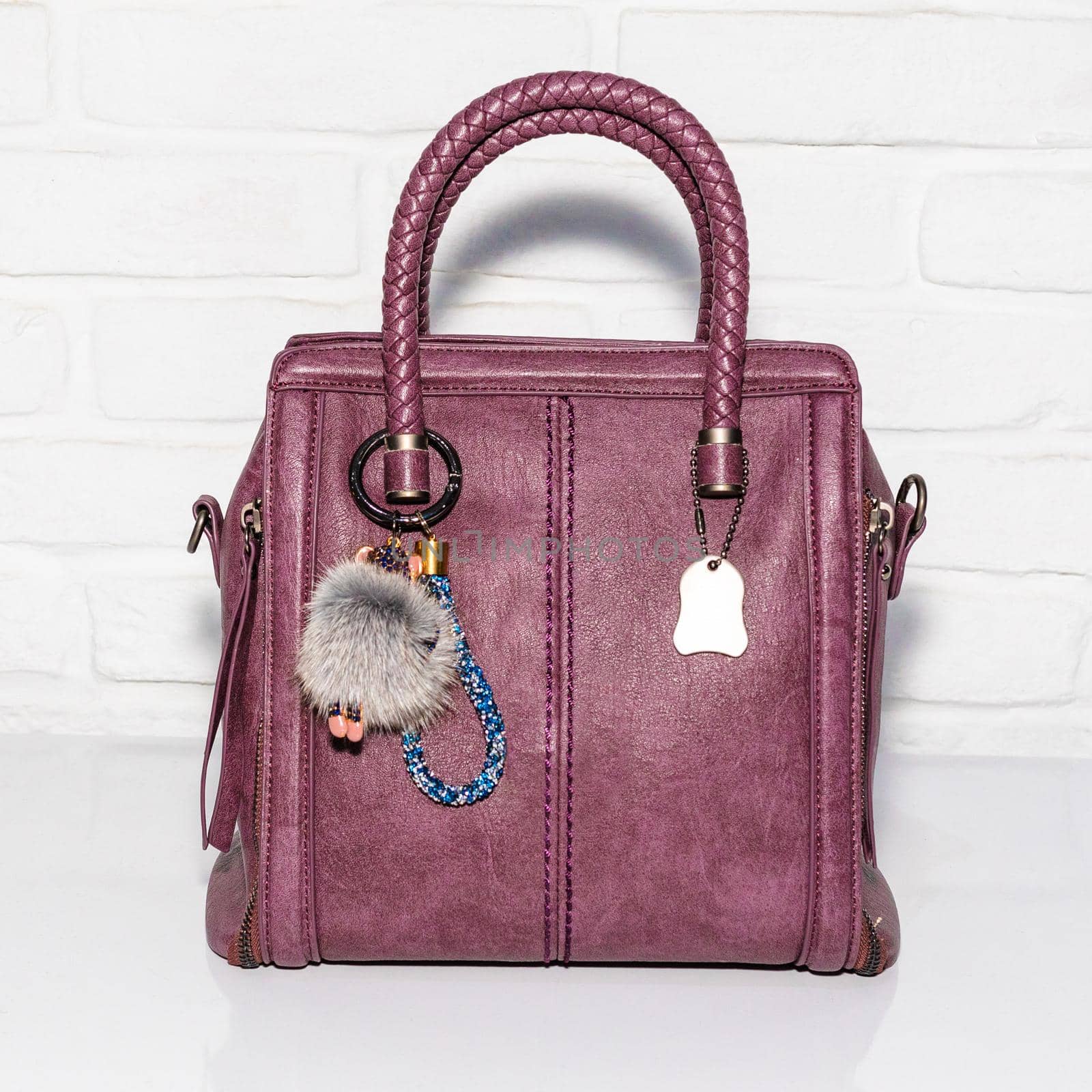 Purple female bag on a white background isolated