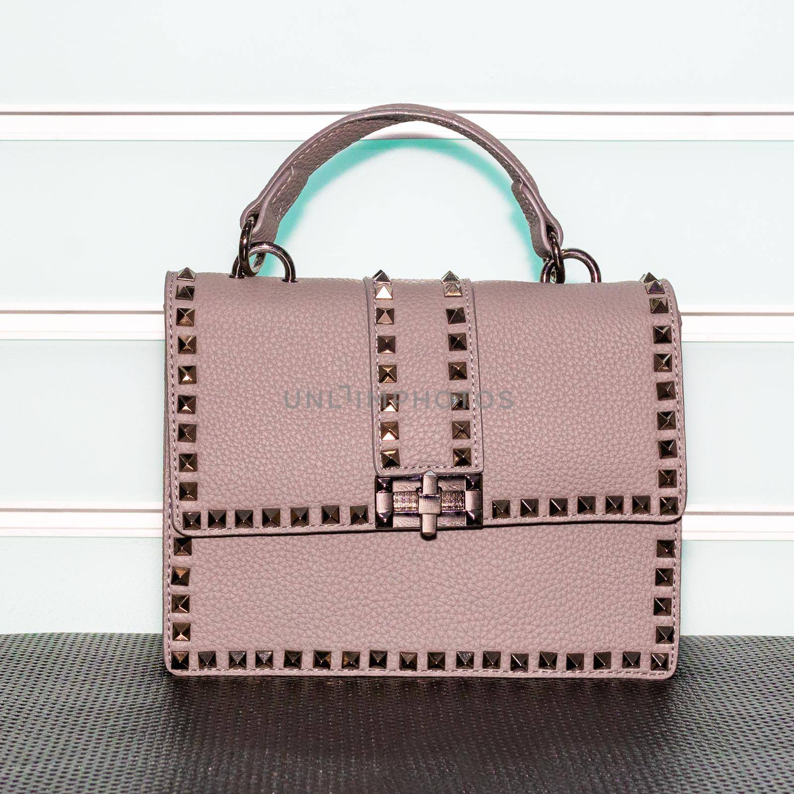 Pink decorated female bag on a white background isolated