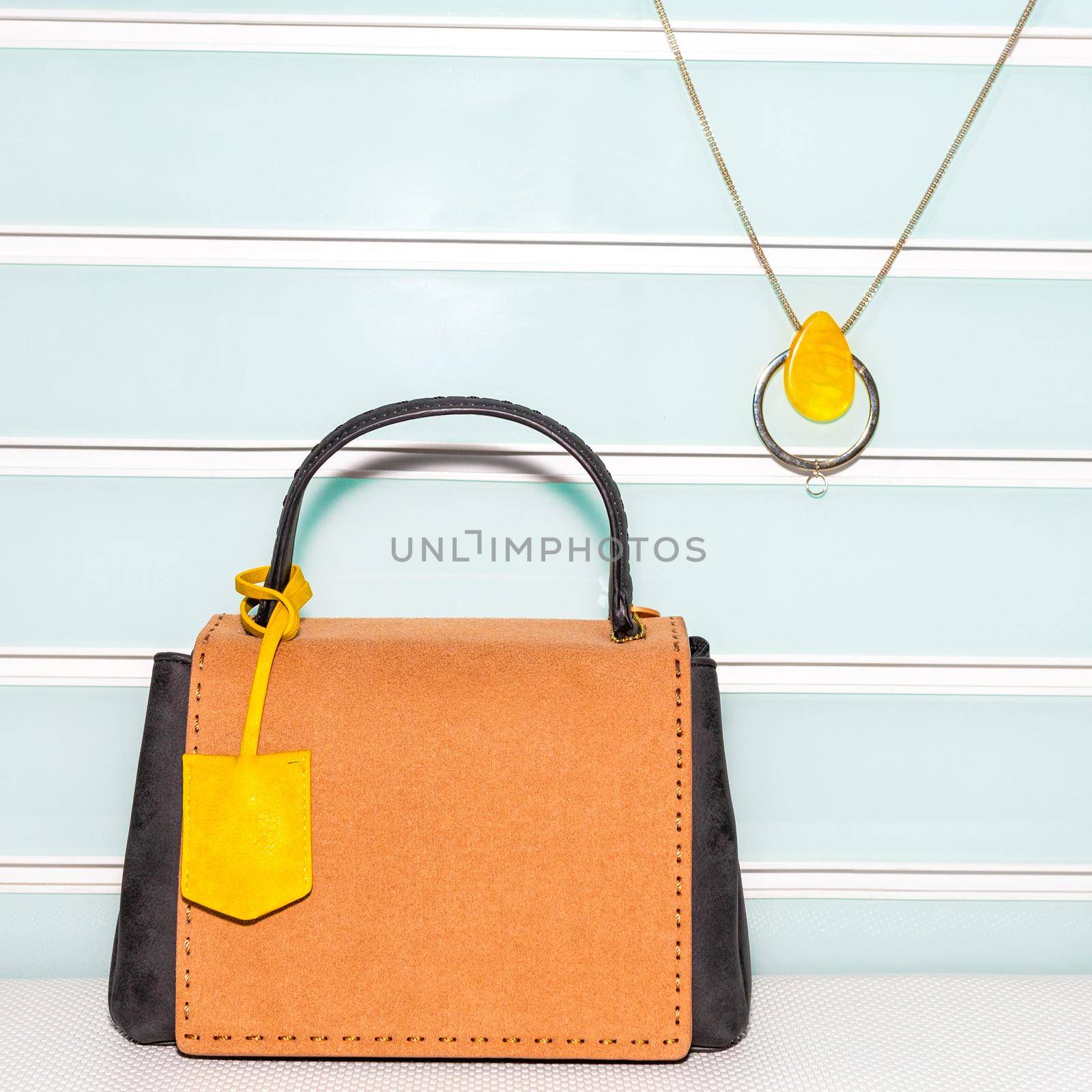 Yellow female bag with accessorize on a white background isolated by ferhad