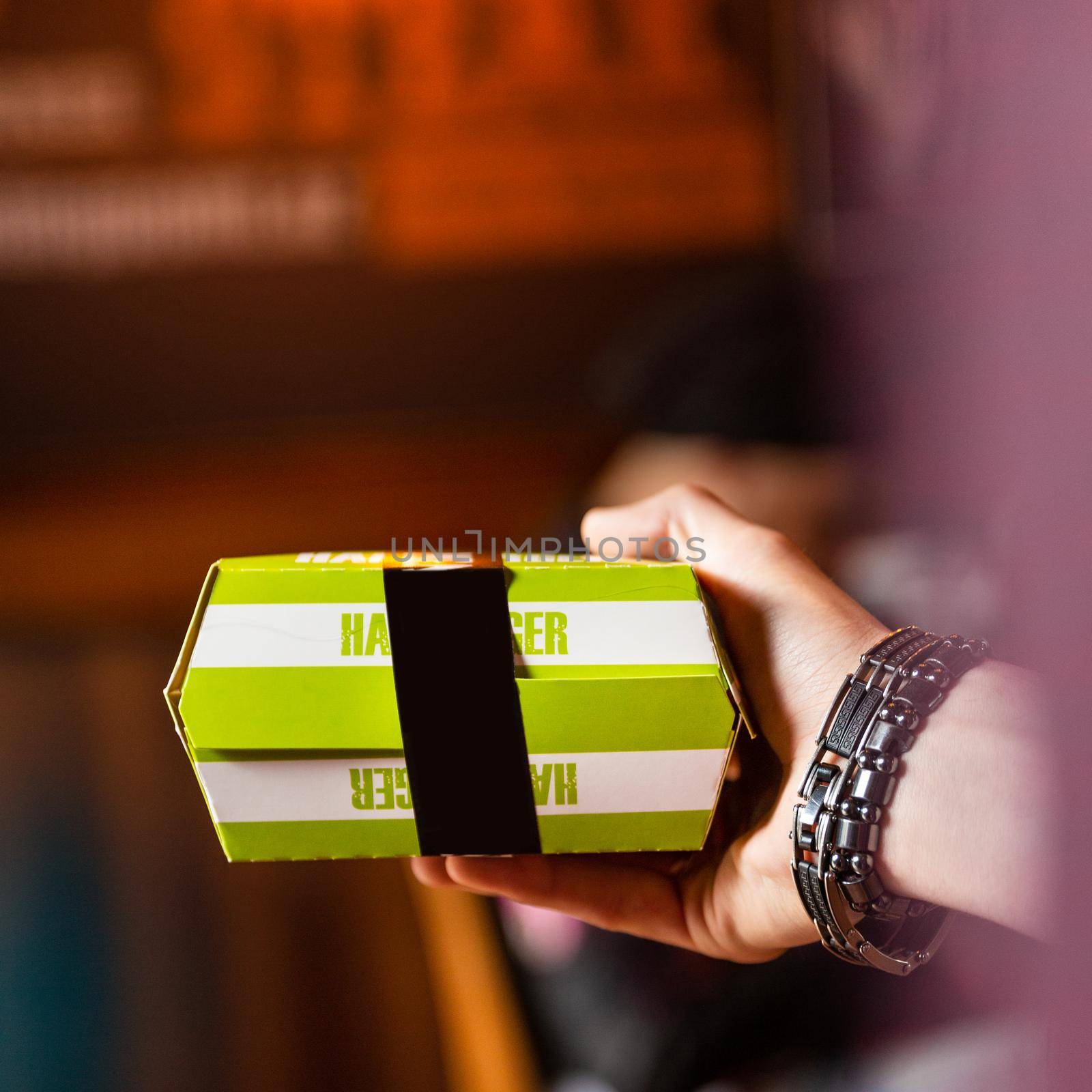 Man holding Packaging for hamburger, burger box by ferhad