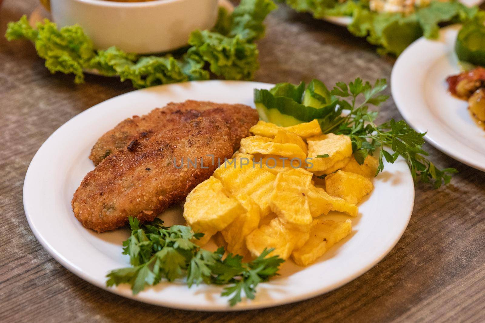 Cutlet with fried potatoes close up