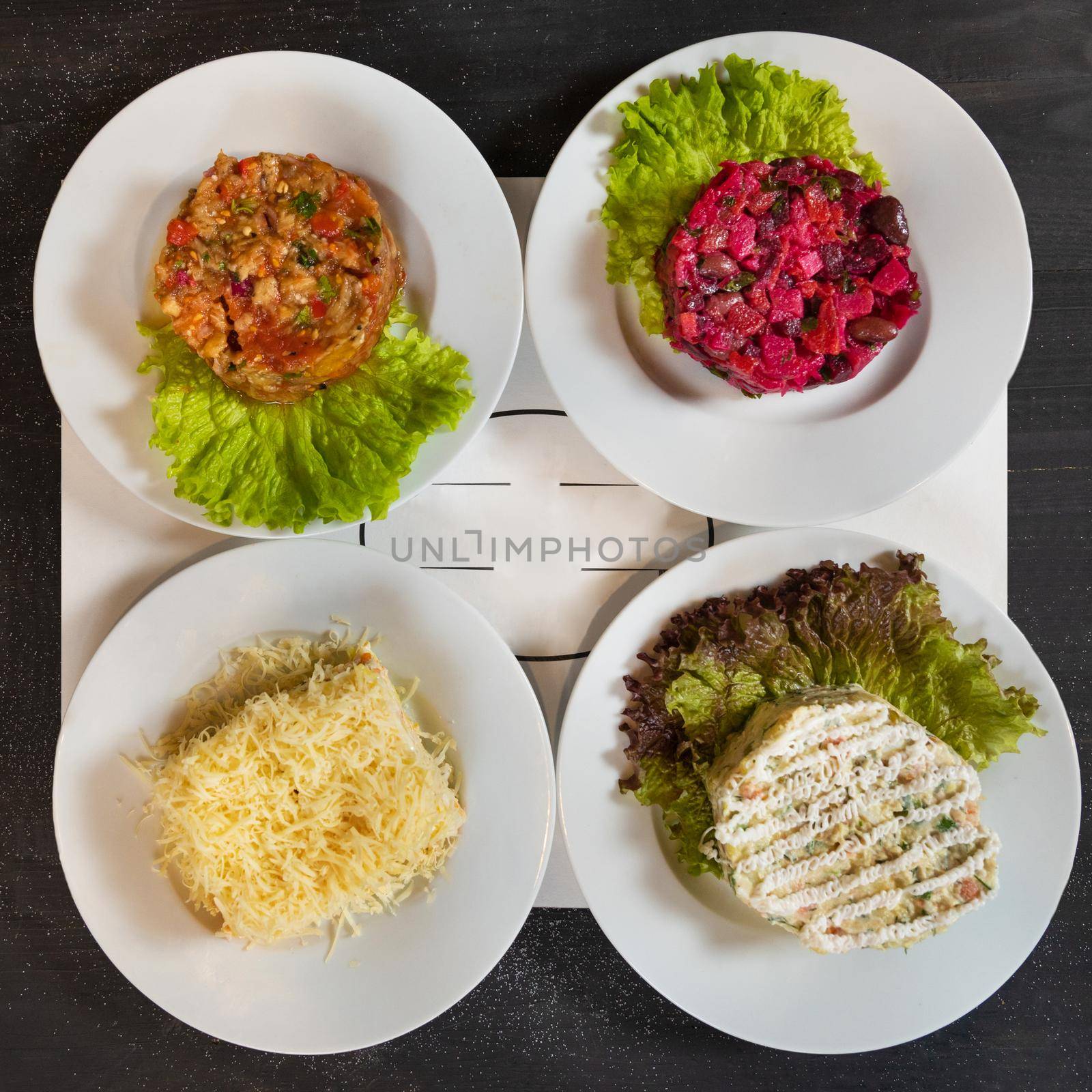 Tasty beetroot, eggplant, mimosa stolichny salad, top view by ferhad
