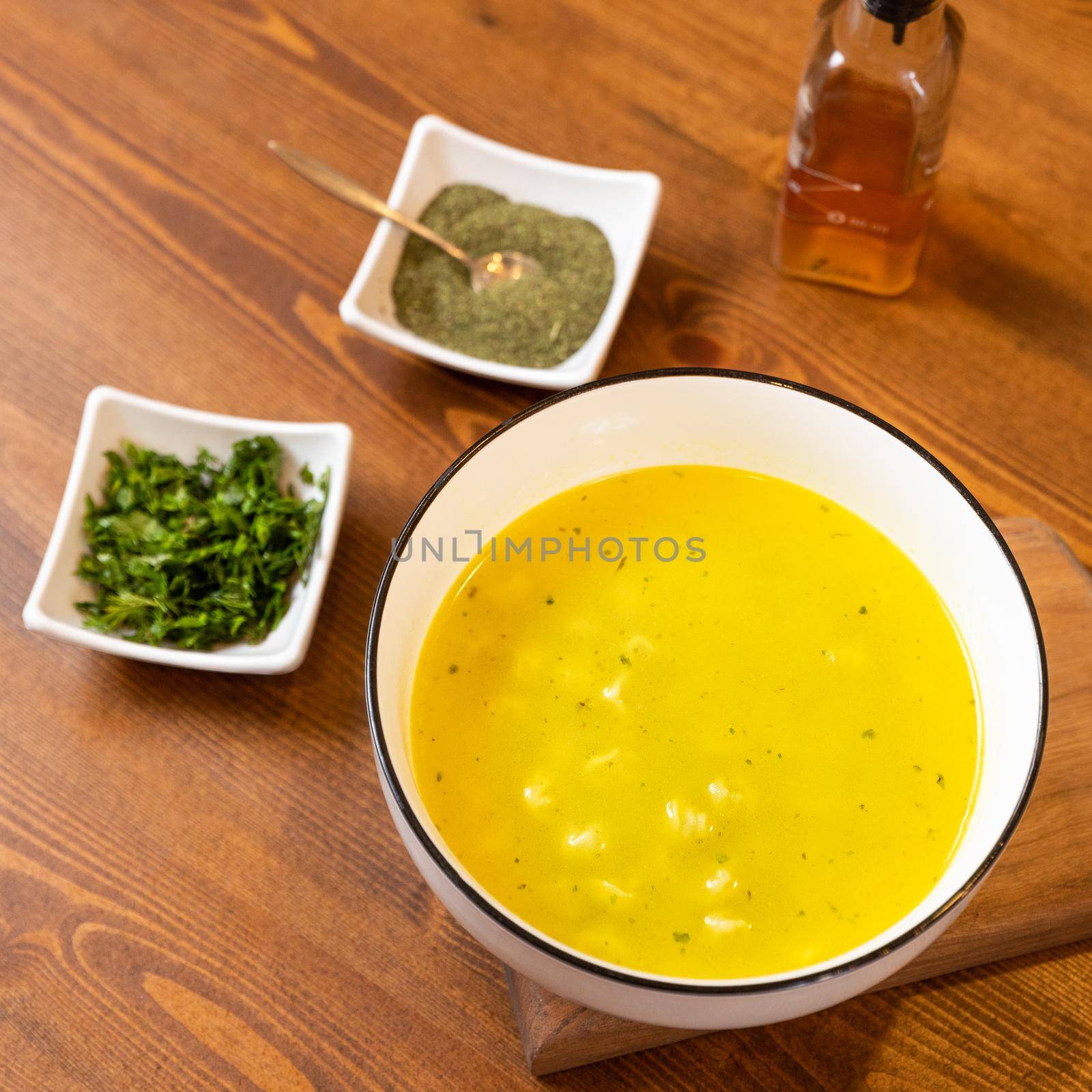 Yellow ginger soup with vinegar
