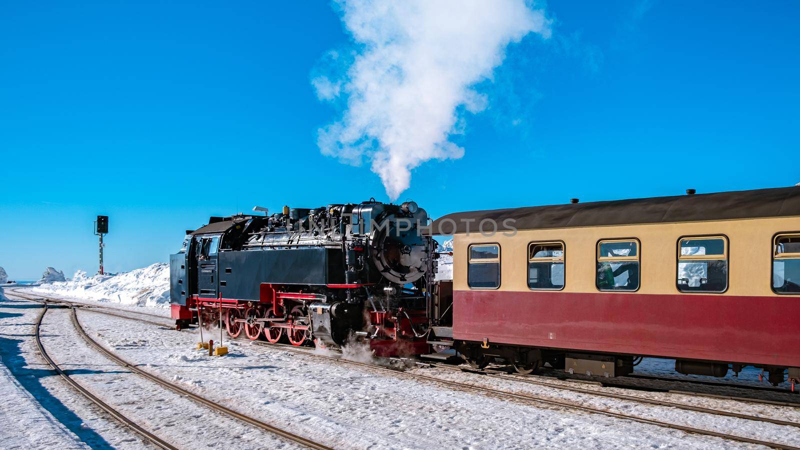 Harz national park Germany, Steam train on the way to Brocken through the winter landscape, Famous steam train through the winter mountain. Brocken, Harz National Park Mountains in Germany Europe