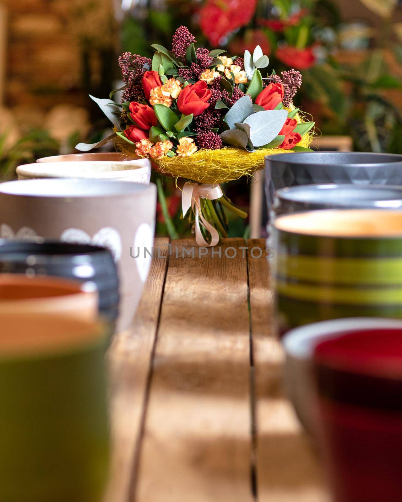 Beautiful flower bouquet with colorful pots