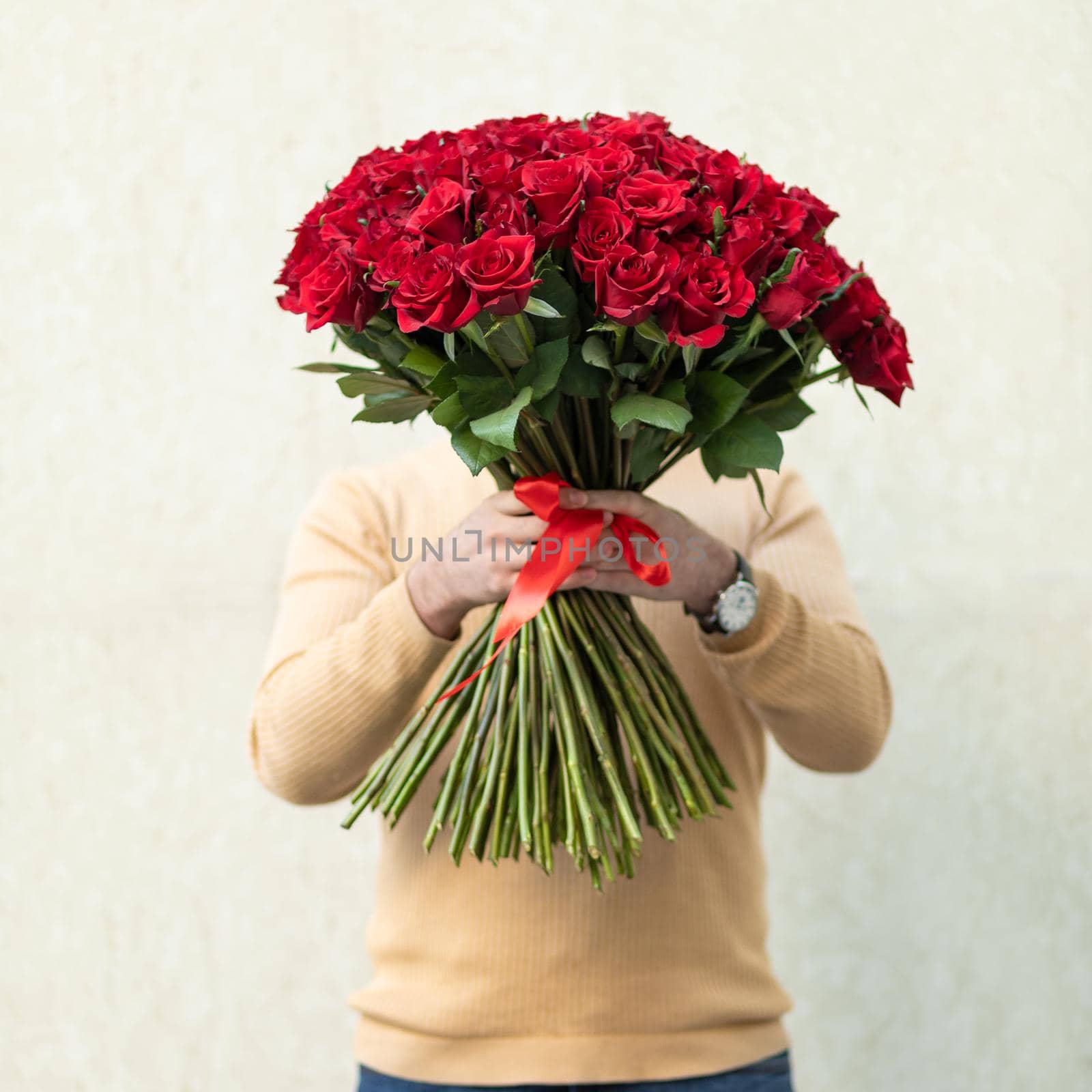 Man holding red rose bouquet by ferhad