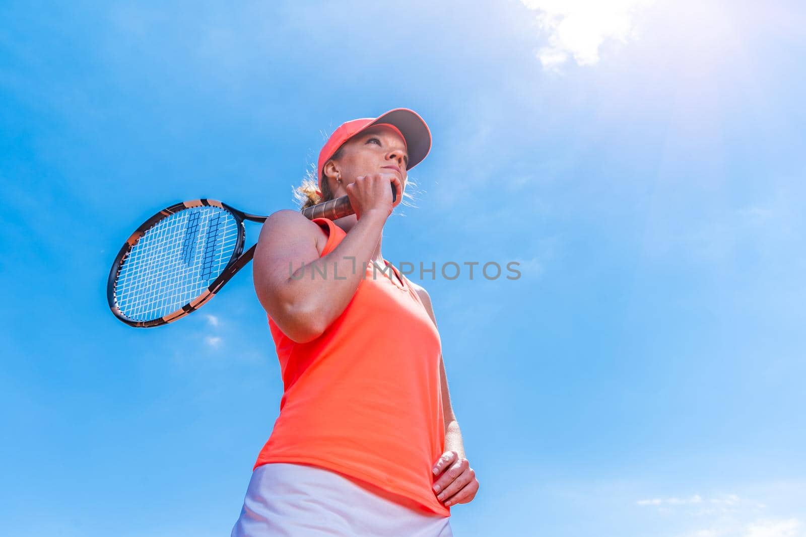 young attractive tennis player on the court by Edophoto