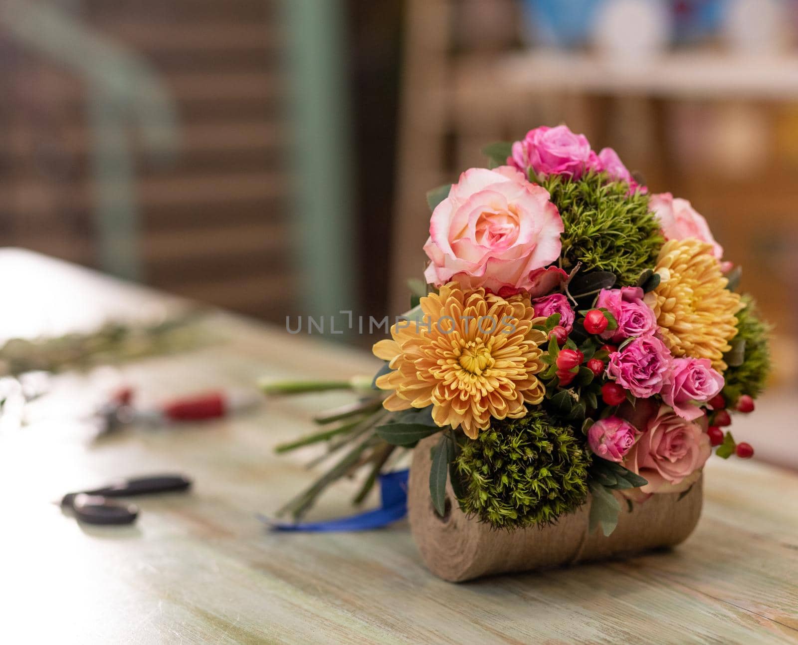 Beautiful flower bouquet in the table with bouquet florist equipments