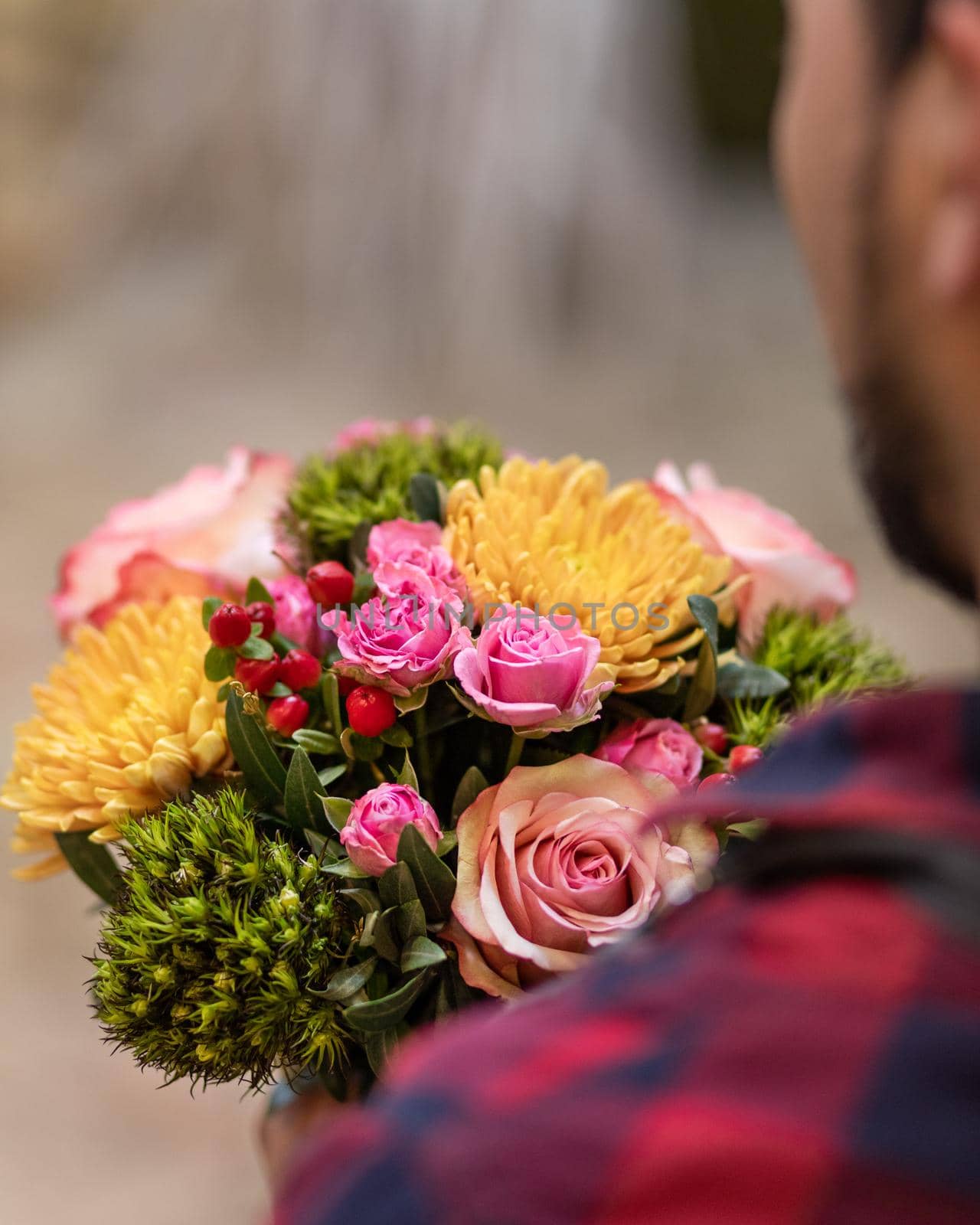 Florist holding flower bouquet