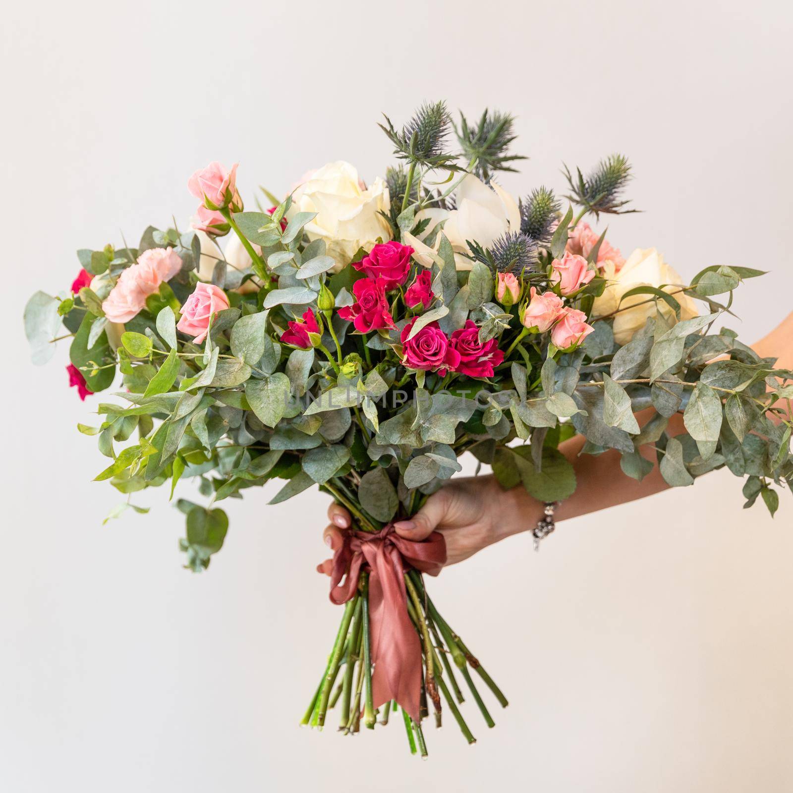 Woman holding beautiful flower bouquet by ferhad