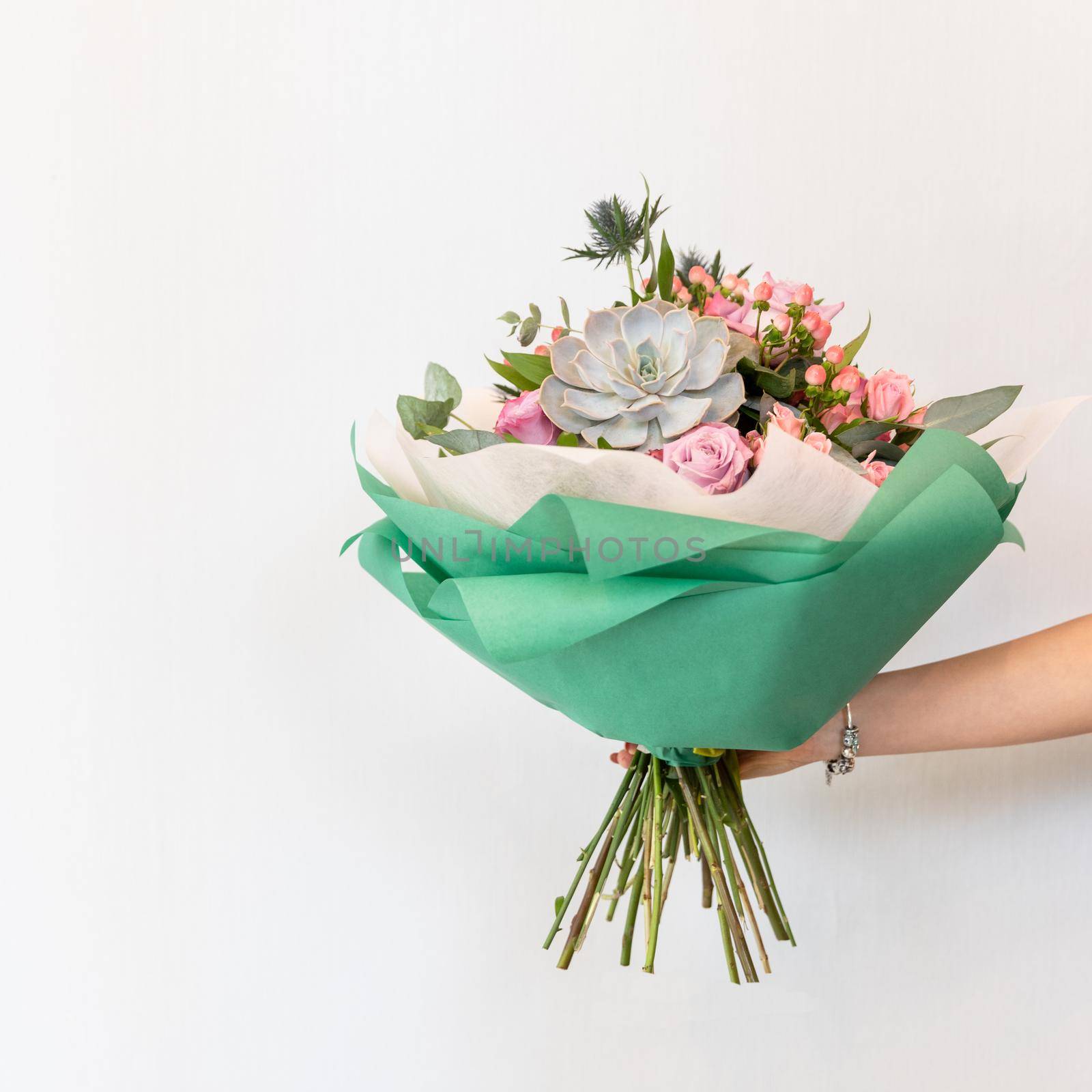 Woman holding colorful flower bouquet with white background