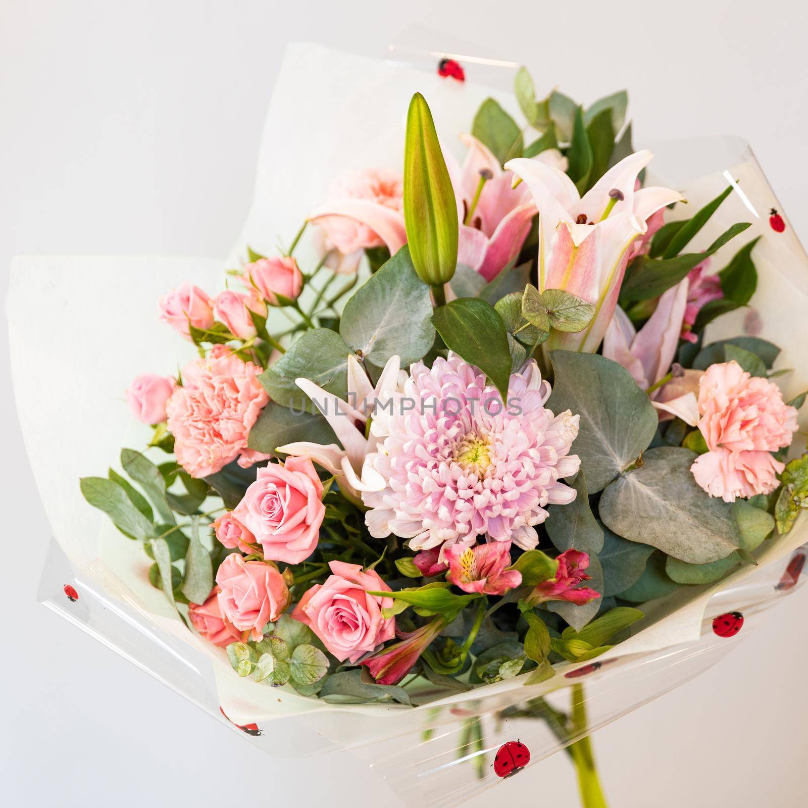 Woman holding colorful flower bouquet close up by ferhad