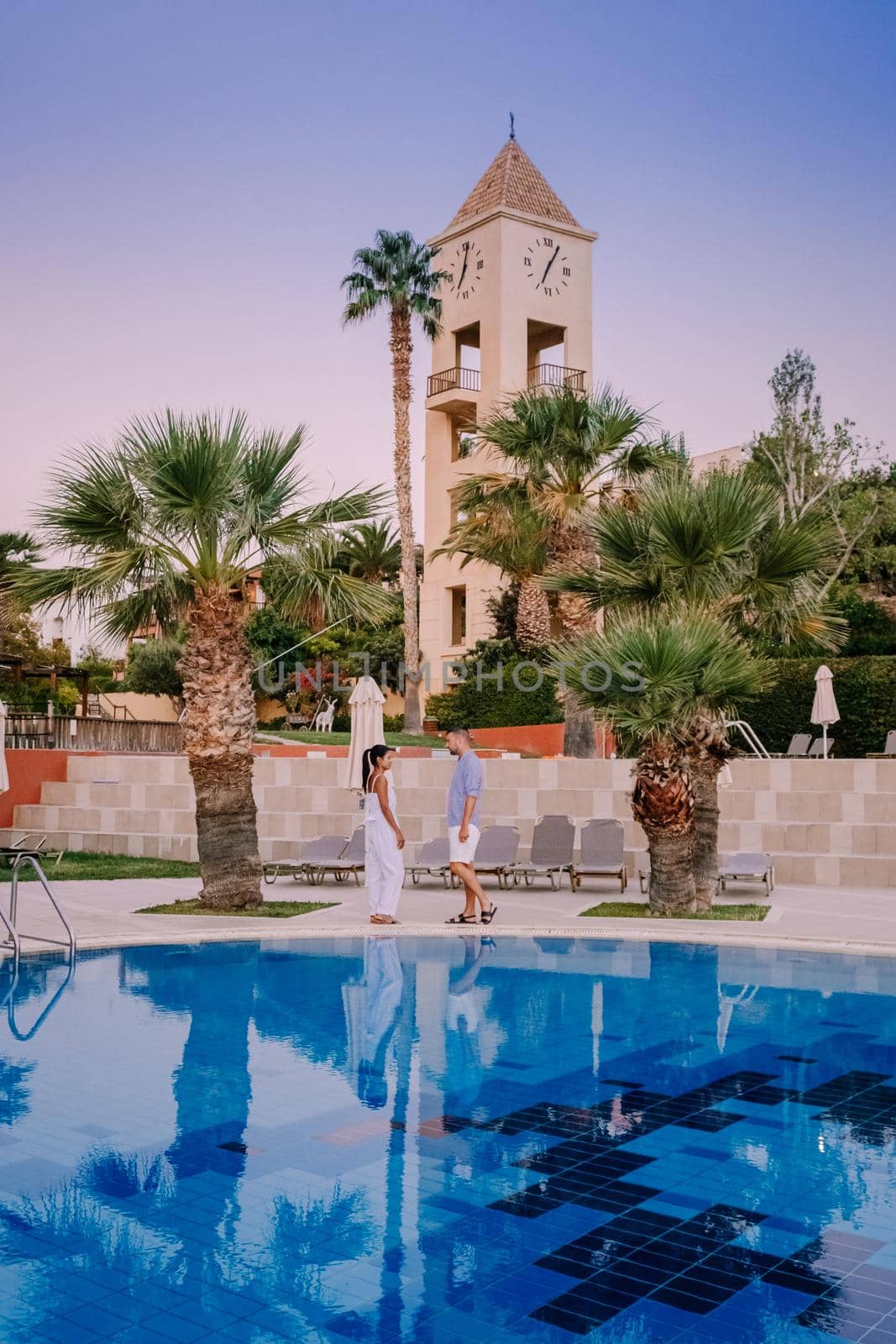 Crete Greece, Candia park village a luxury holiday village in Crete Greece by the ocean in traditional colors. Couple on vacation luxury resort