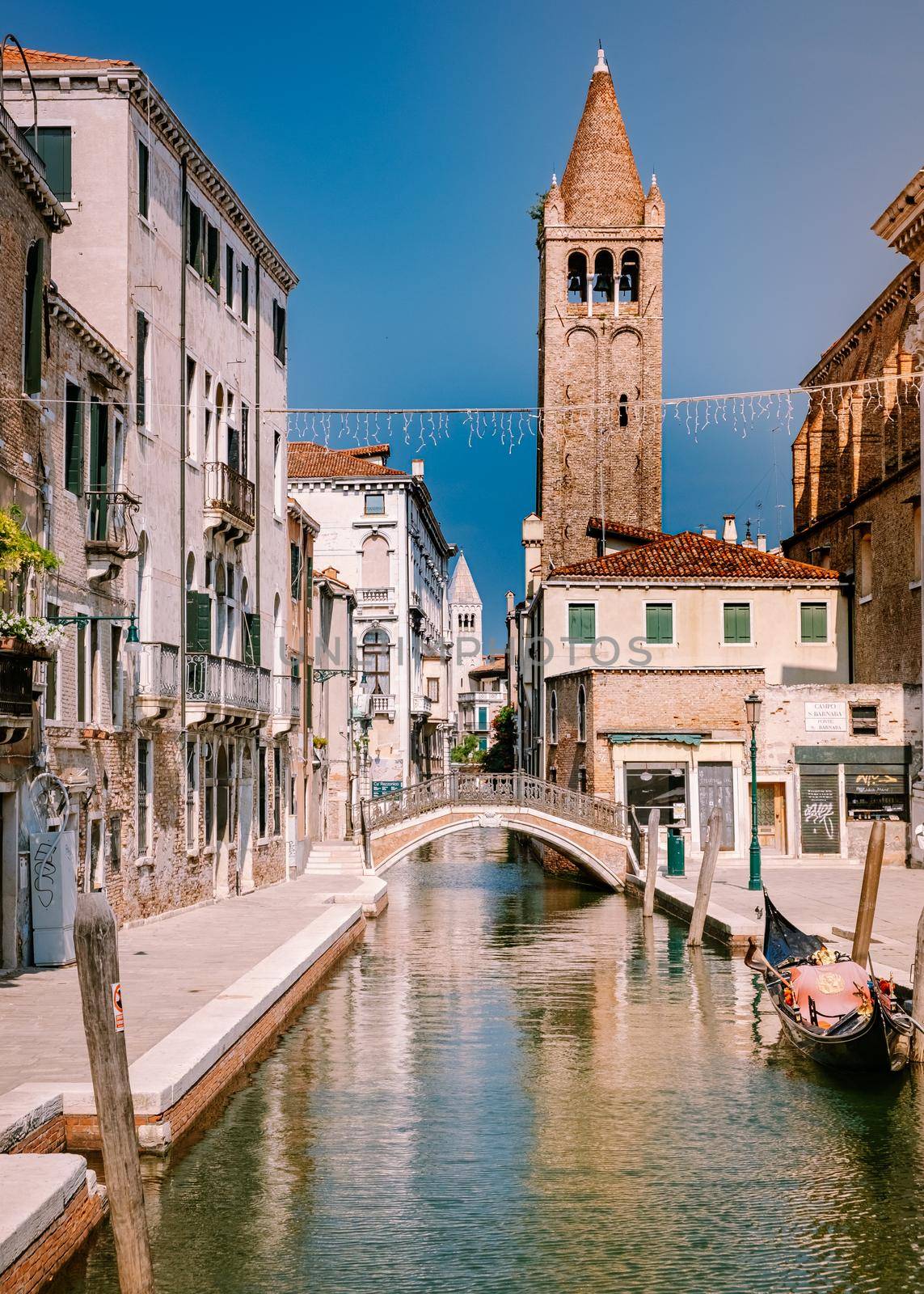 Beautiful venetian street in summer day, Italy. Venice Europe