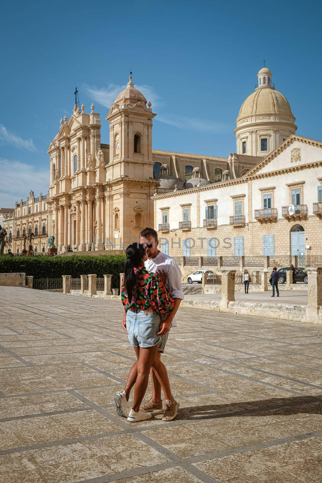 Sicily Italy, view of Noto old town and Noto Cathedral, Sicily, Italy. beautiful and typical streets and stairs in the baroque town of Noto in the province of Syracuse in Sicily, a couple on city trip Noto