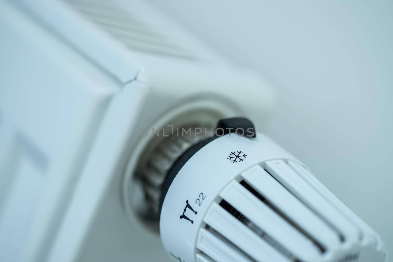 Heat regulator on a heater, close up picture. Heating Costs. by Daxenbichler