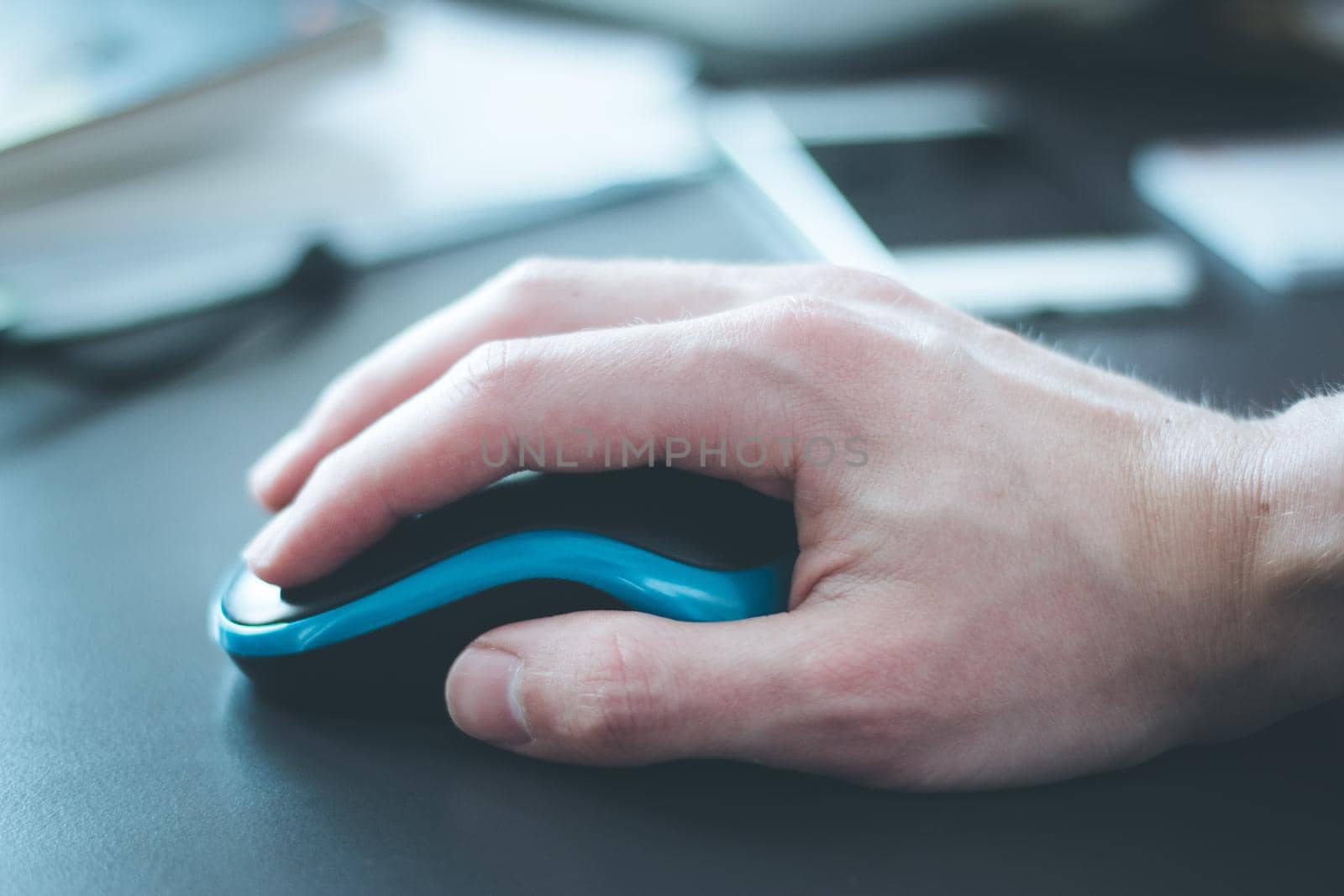 Close up of computer mouse used by a male hand