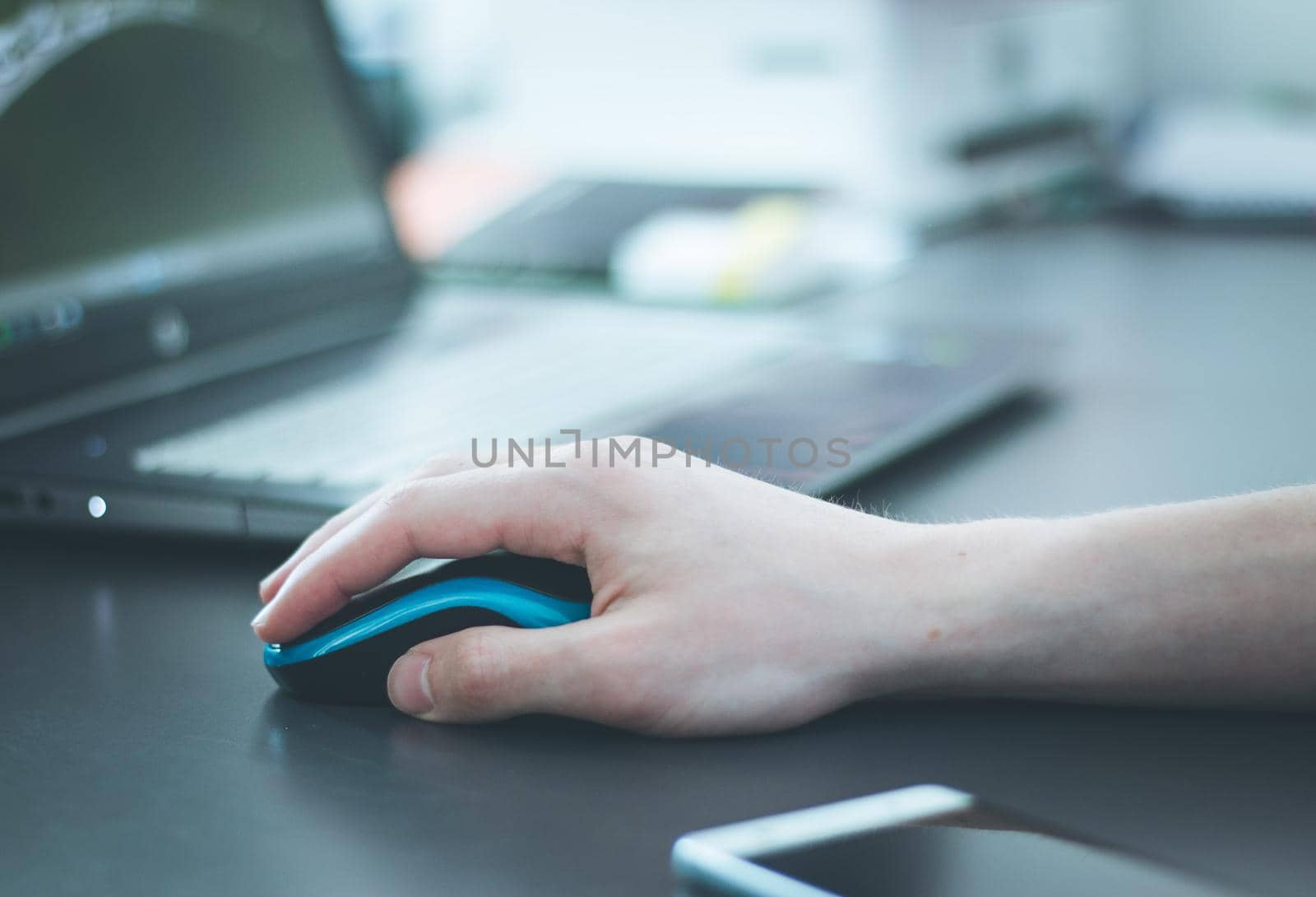 Close up of computer mouse used by a male hand