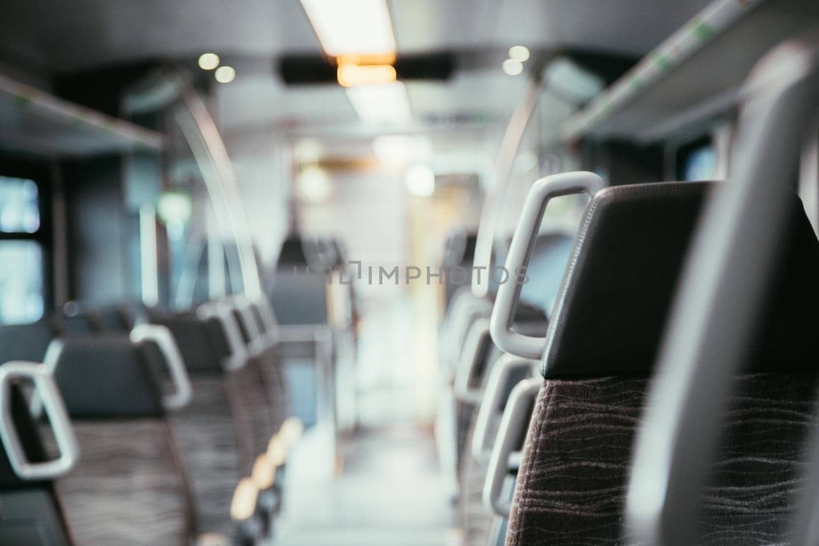 Interior of a public transport train, blurry background
