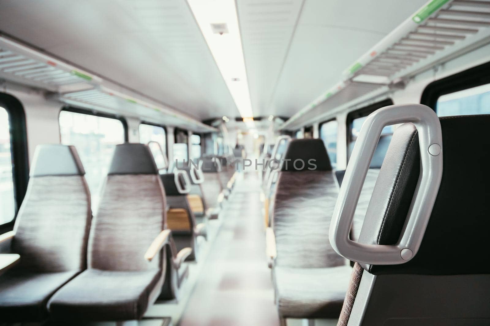 Interior of a public transport train, blurry background