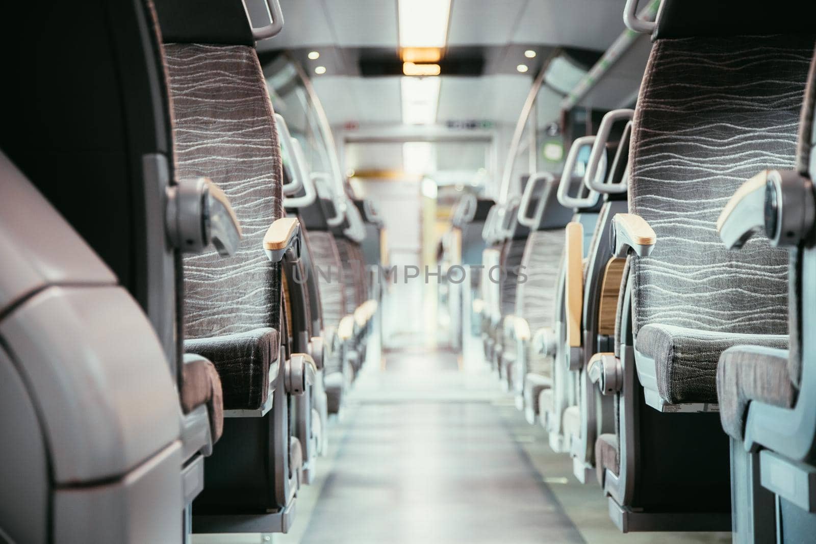 Interior of a public transport train, blurry background
