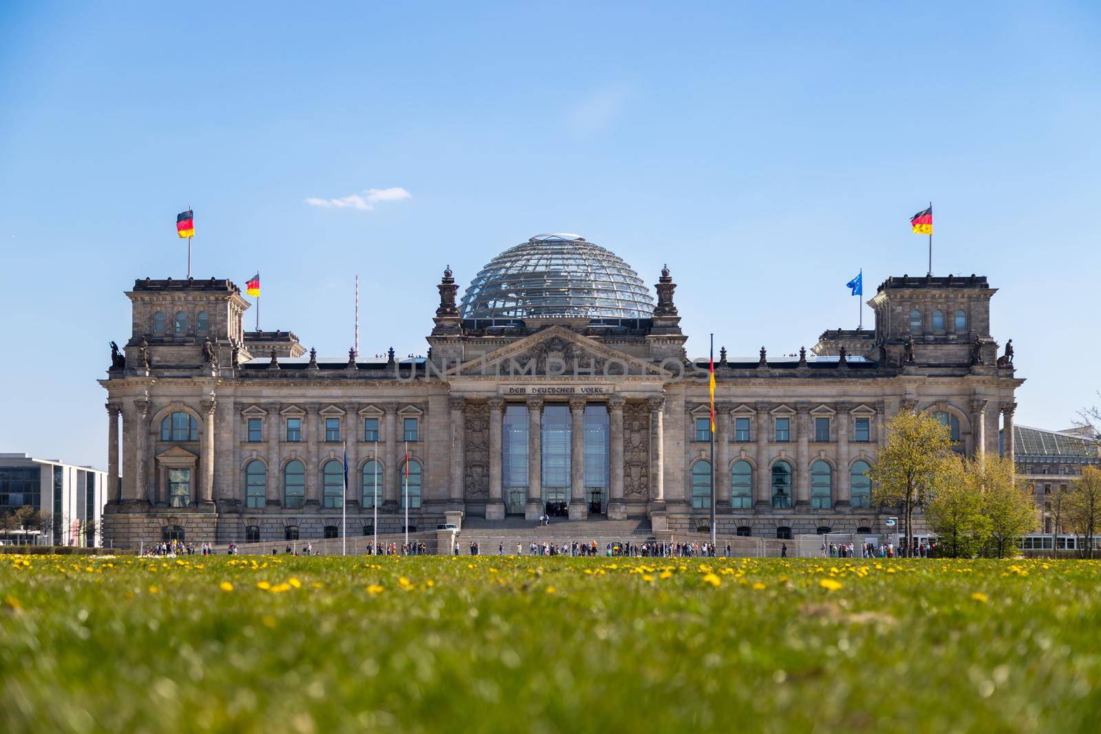 Picture of the Reichstag in Berlin in Springtime, green grass and flowers