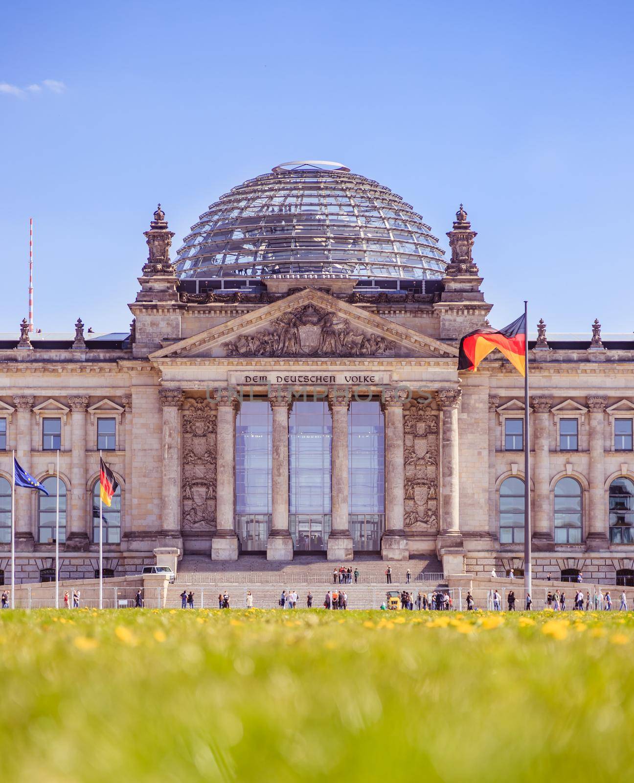 Picture of the Reichstag in Berlin in Springtime, green grass and flowers