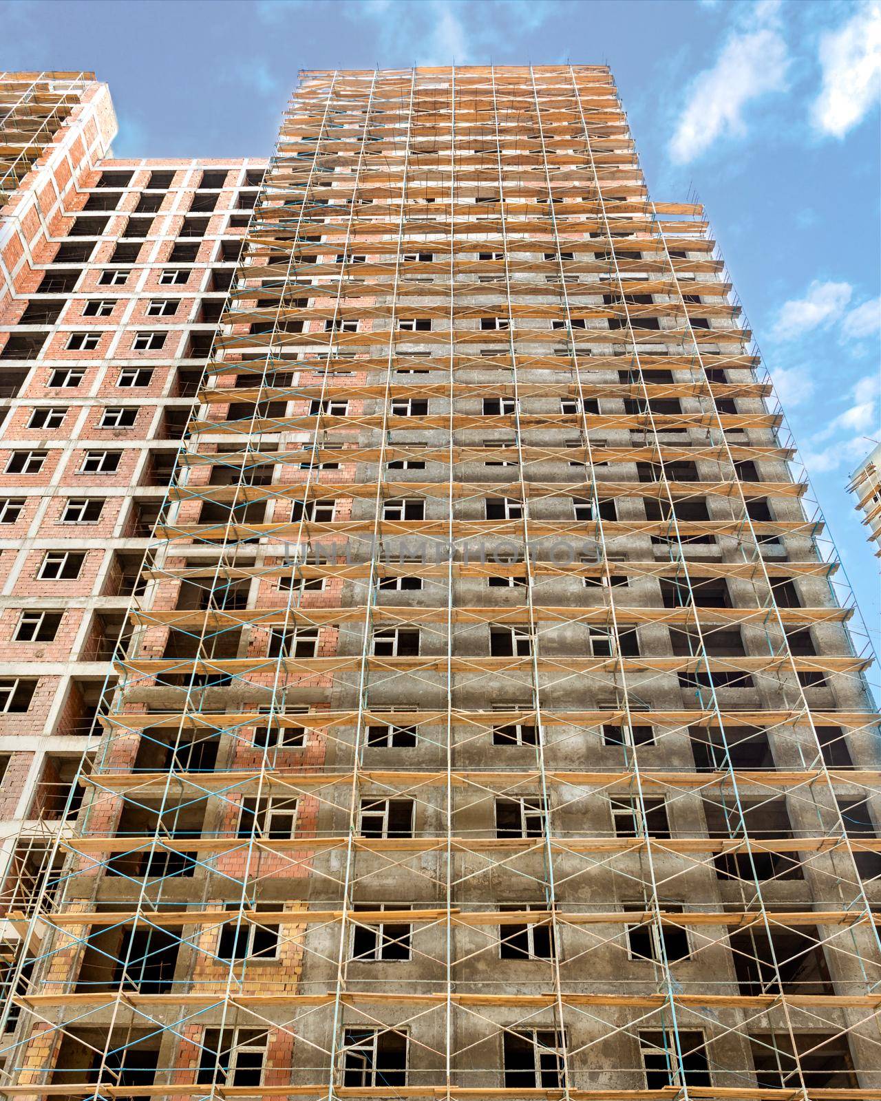 High buildings with scaffold at the construction site