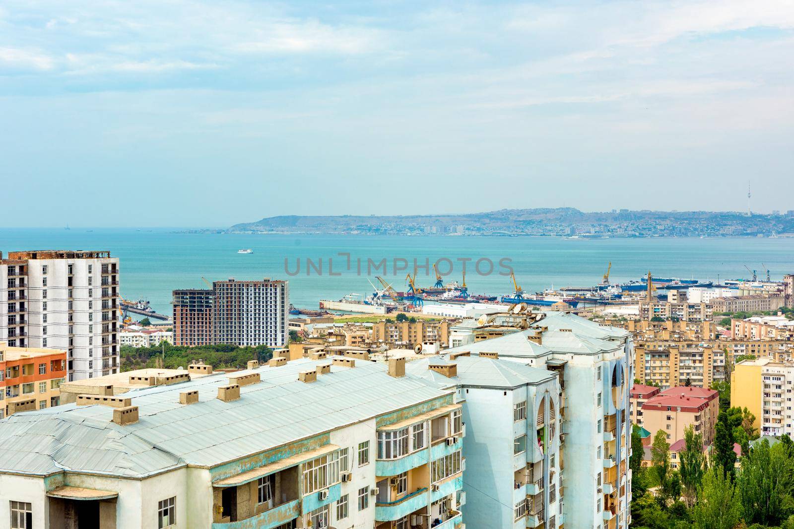 High buildings scaffold at the construction site, city view by ferhad