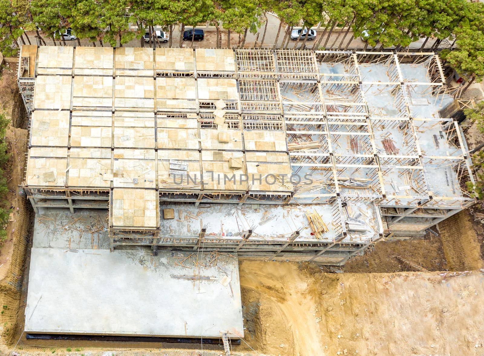 Building garage top view with scaffold at the construction site by ferhad
