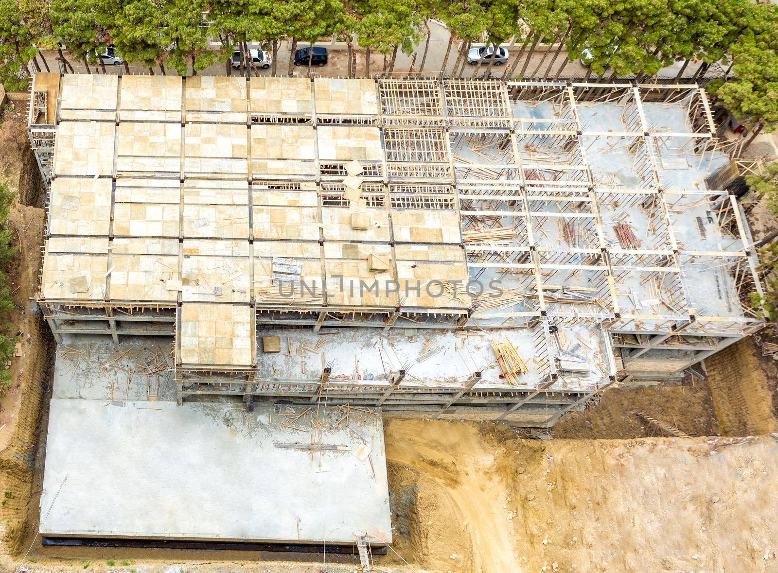 Building garage top view with scaffold at the construction site