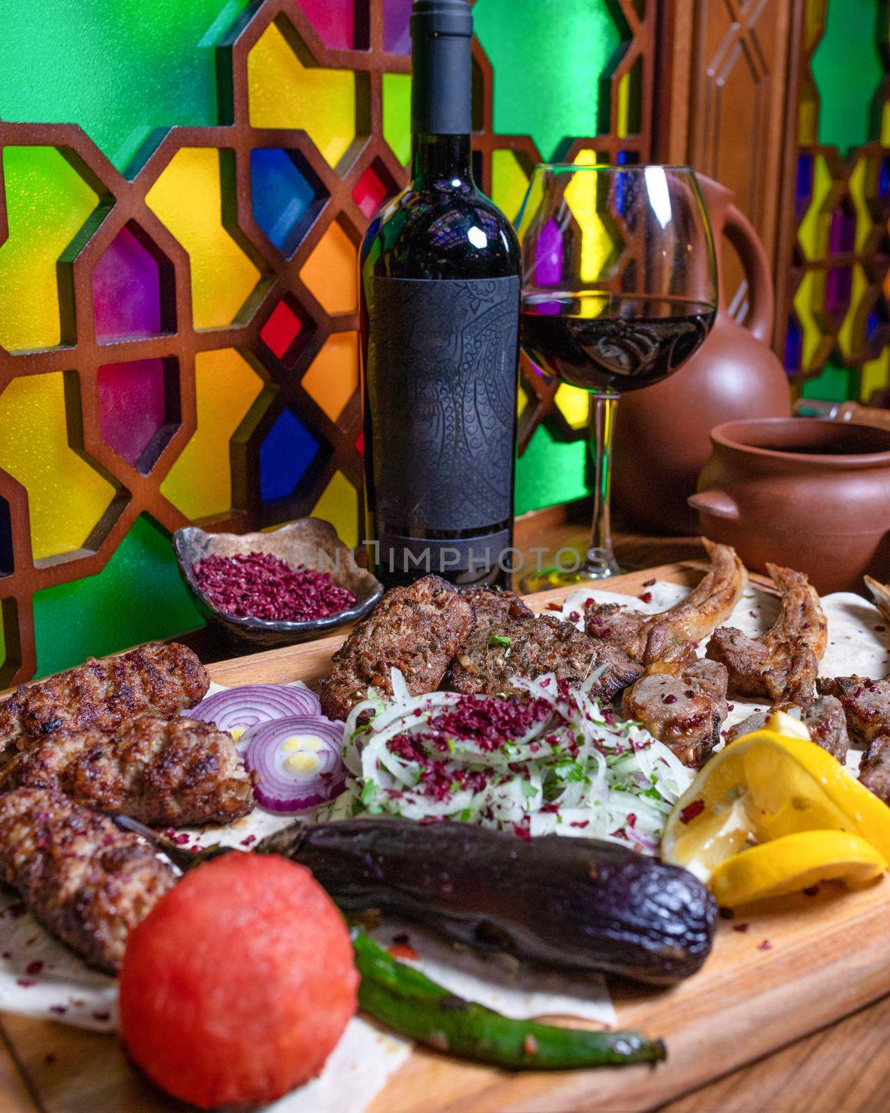 Lyulya kebab, sheep meat meal with wine bottle and glass