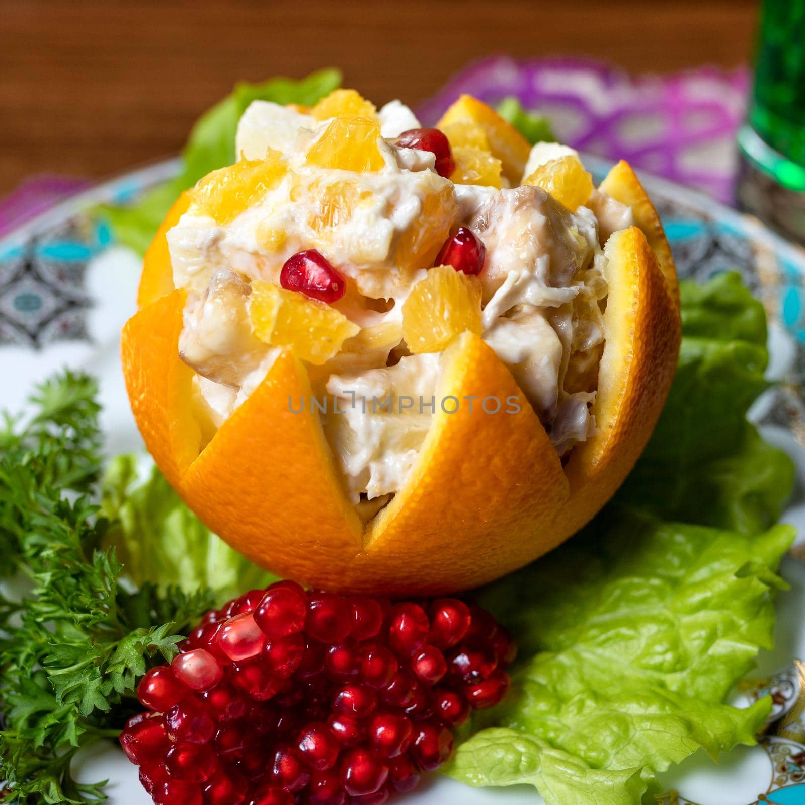 Orange snack with pomegranate close up