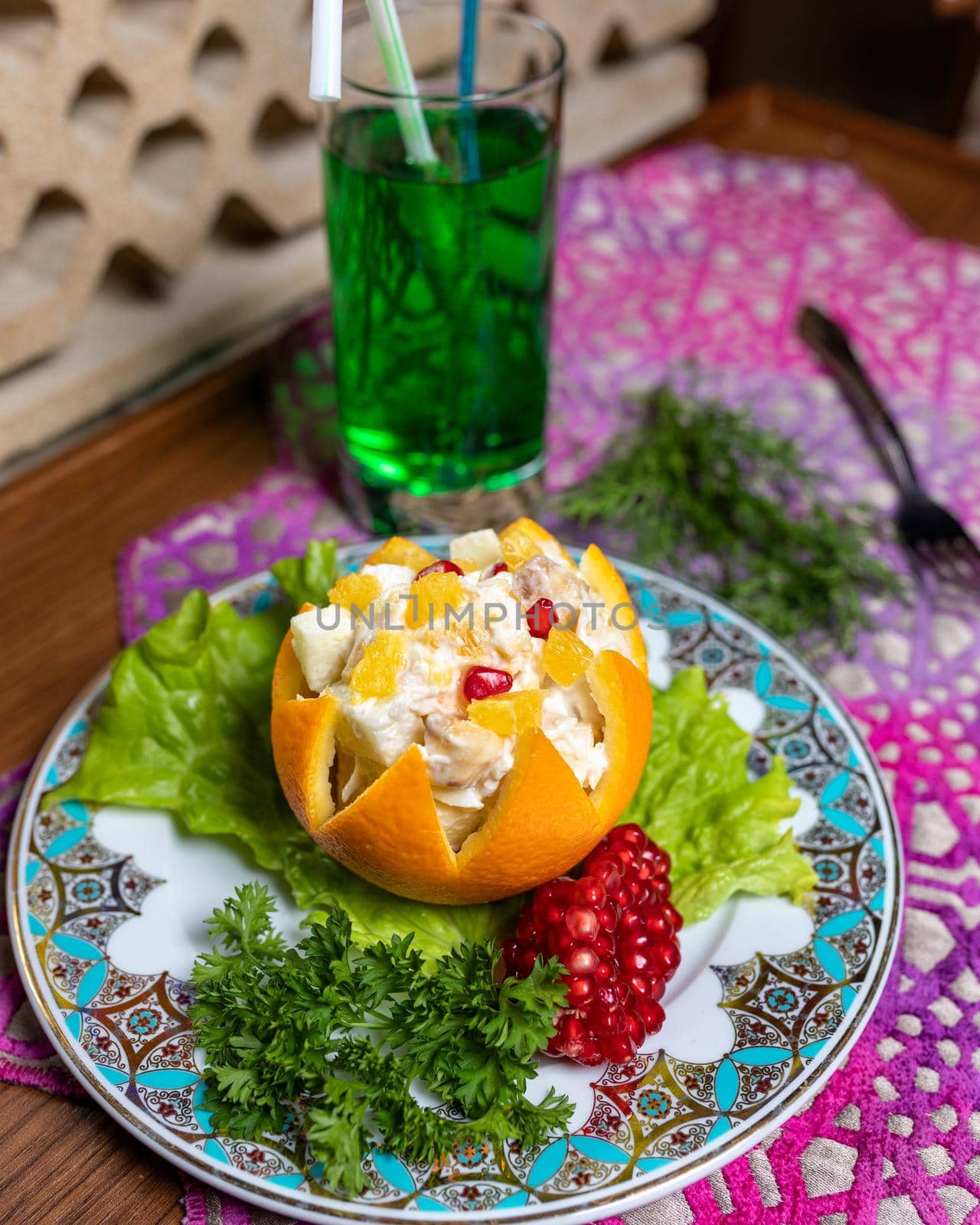 Orange snack with pomegranate close up