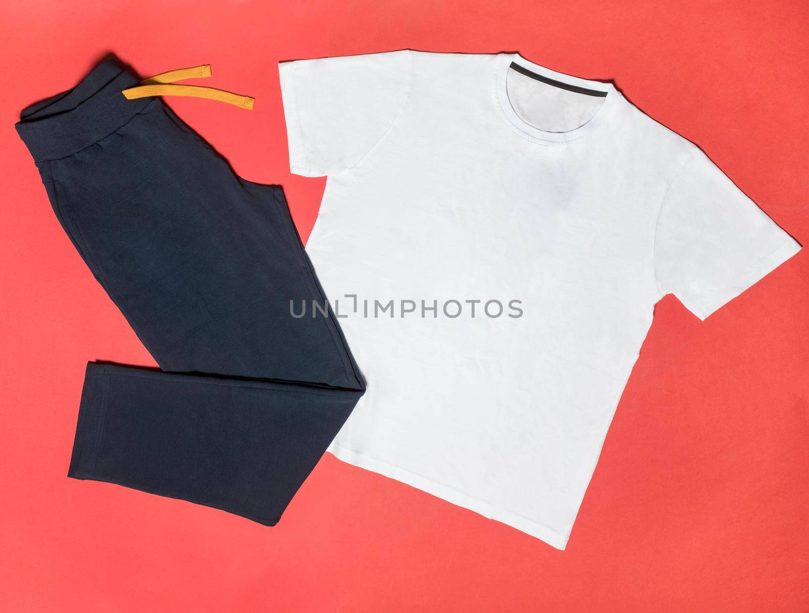 White man sport t-shirt with black sports pants isolated by ferhad