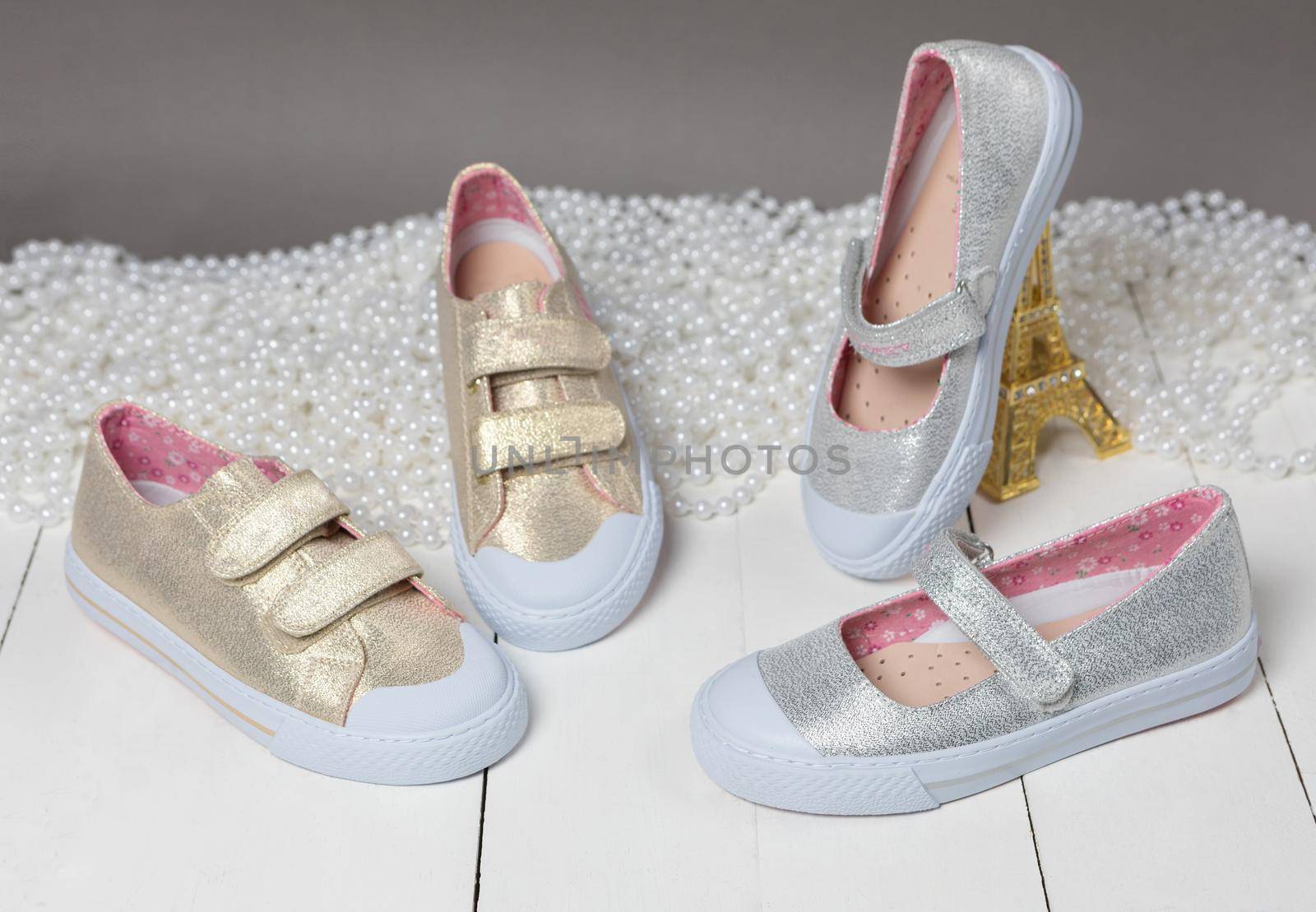 Gold color girl shoes isolated