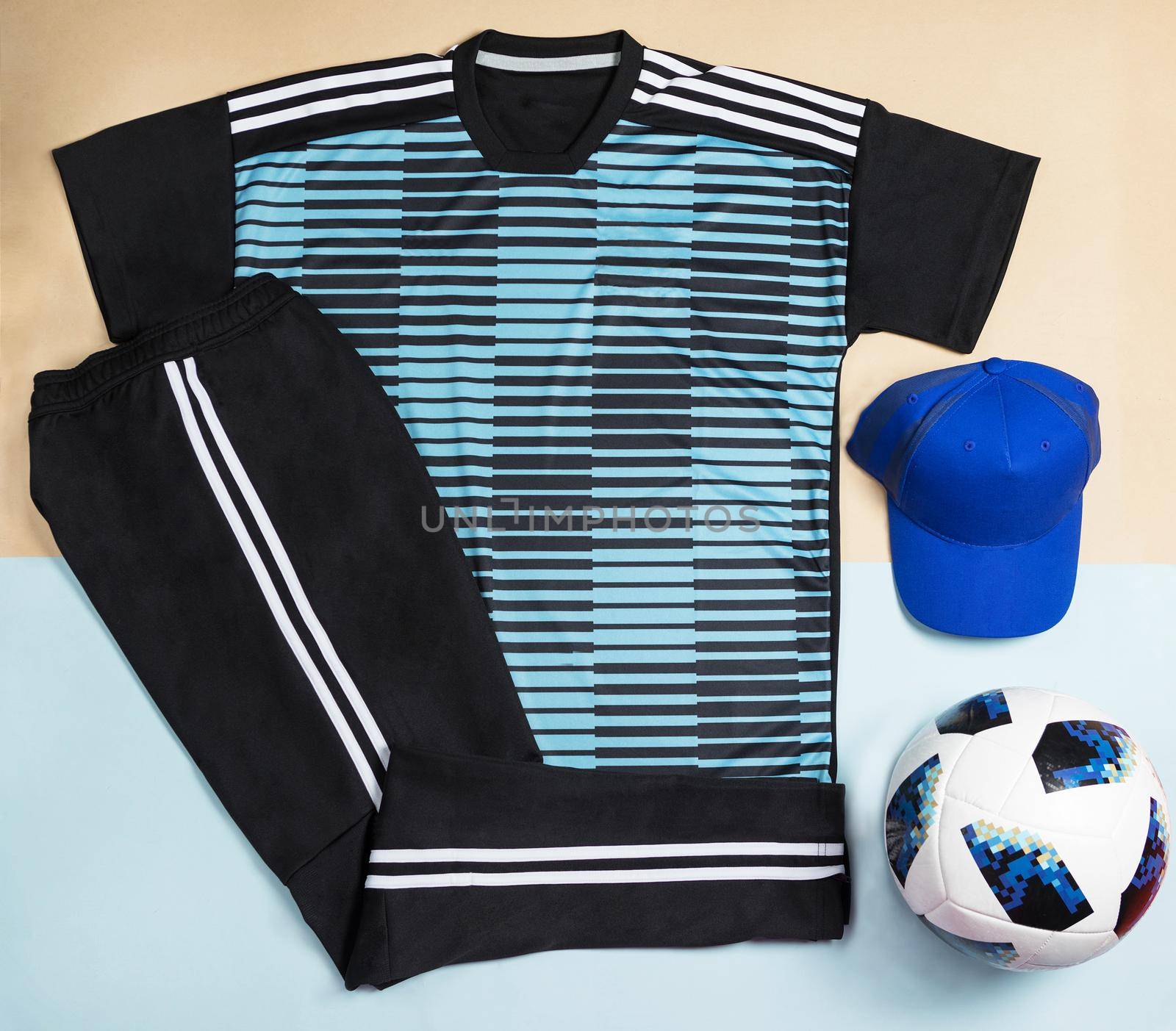 Blue soccer t-shirt design slim-fitting with a cap an ball top view by ferhad