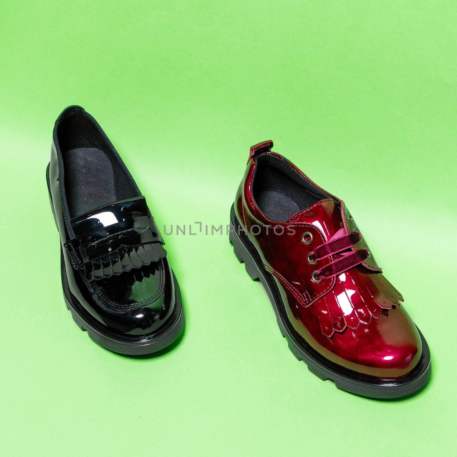 Red and black shiny male shoes isolated