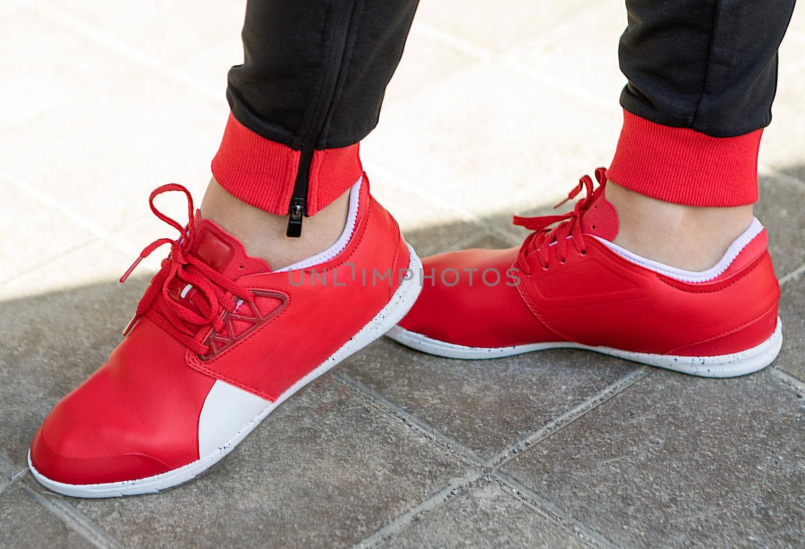Woman with a red running shoes close up by ferhad