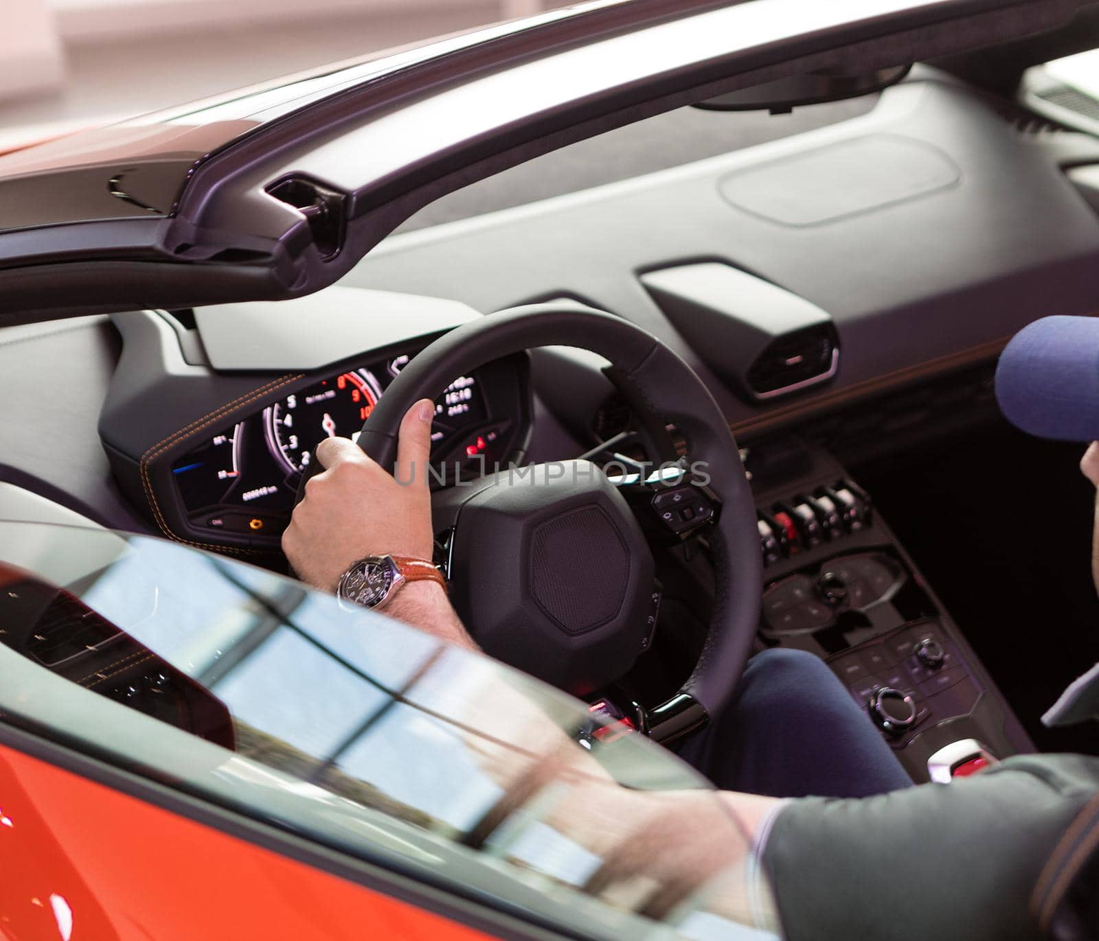 Man driving a cabriolet sports car close up