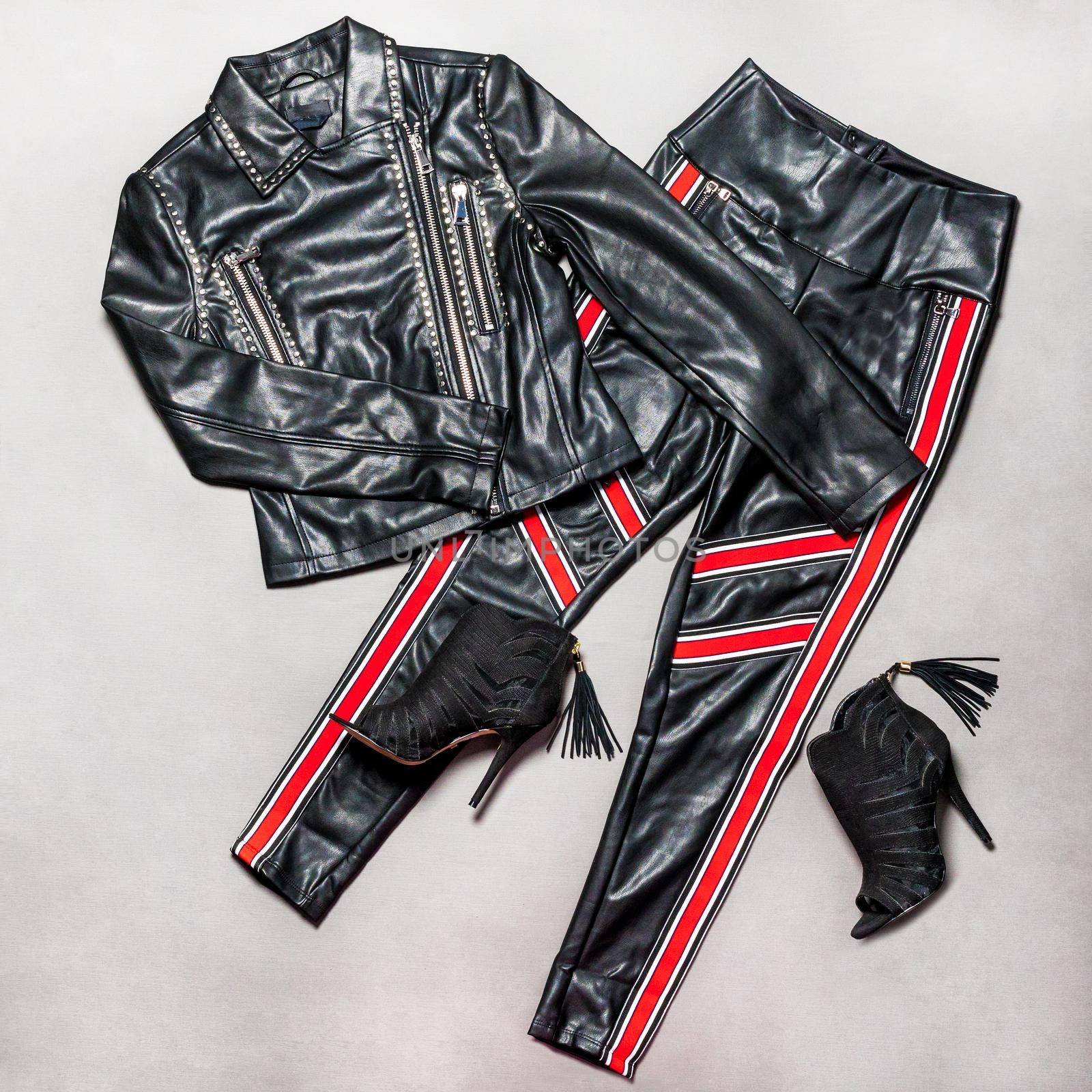Black and red leather woman jacket pant and shoe isolated