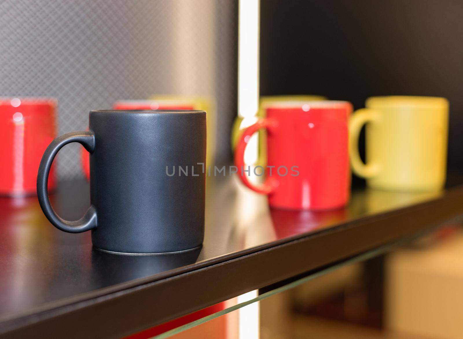 Colorful cups on the showcase close up by ferhad