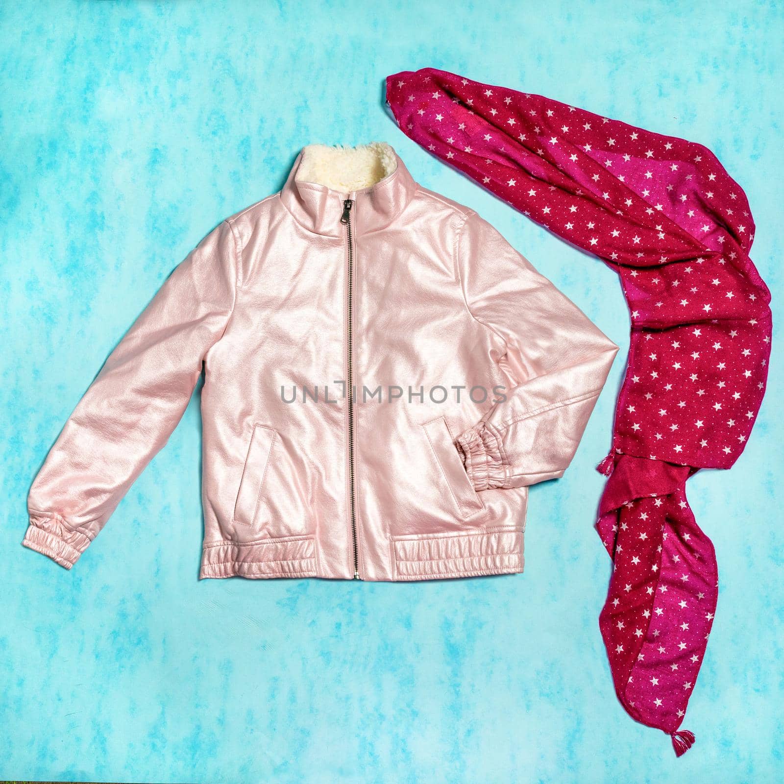 Pink woman jacket with a red scarf isolated by ferhad