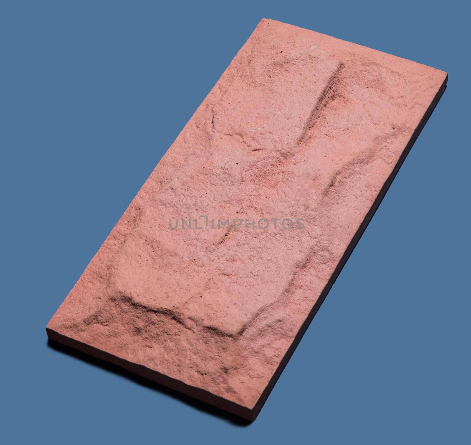 A sample of ground, wall stone shape on the unicolour background