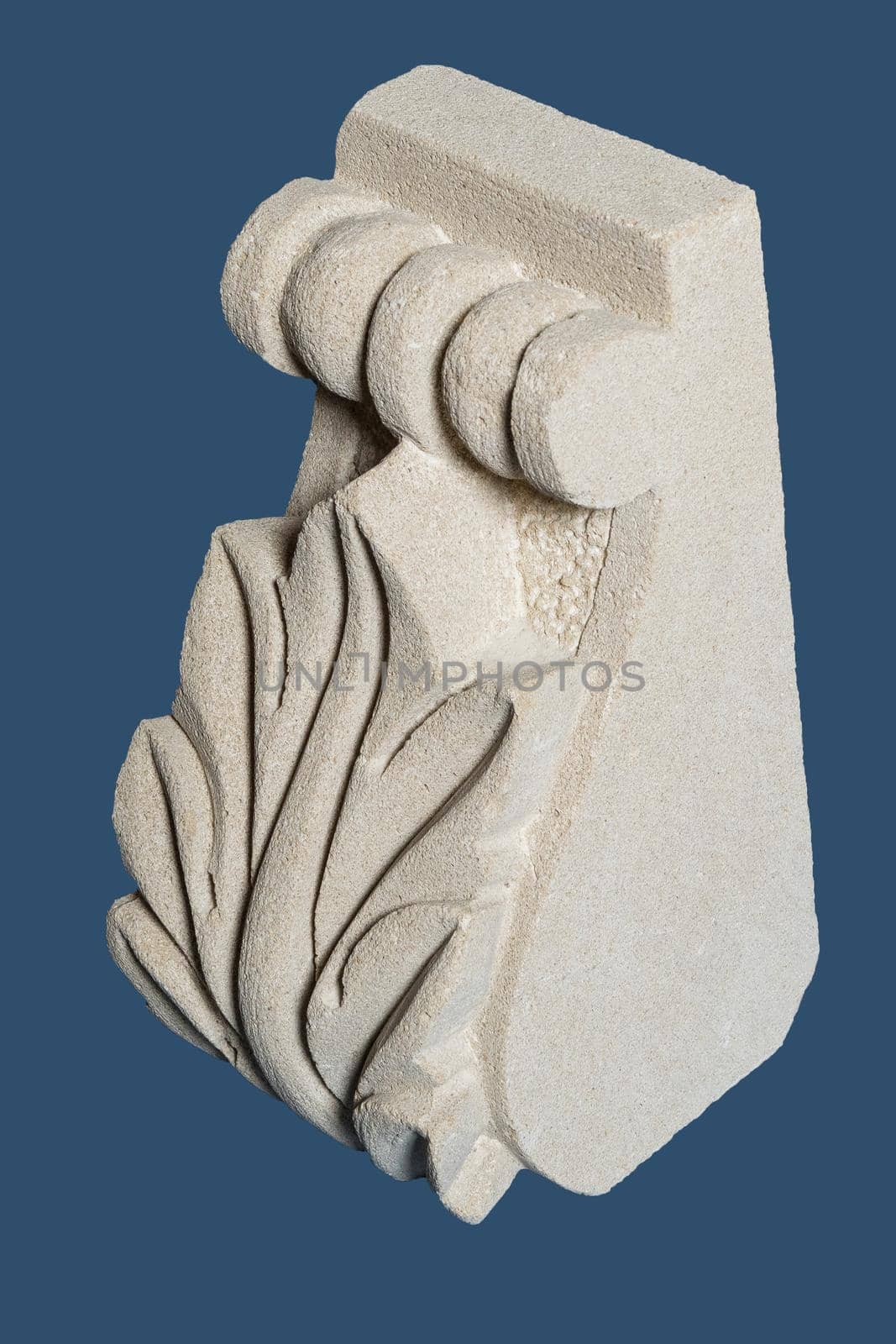 Plaster graceful decoration on the columns, dark background