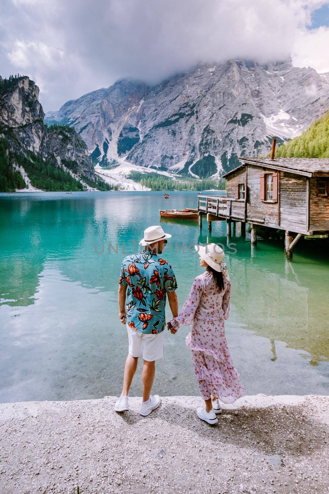 couple visit the famous lake Lago Di Braies Italy, Pragser Wildsee in South Tyrol, Beautiful lake in the italian alps, Lago di Braies by fokkebok