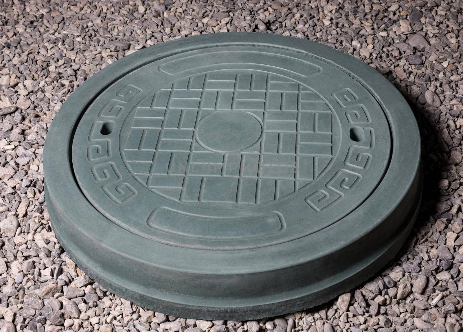 Plaster graceful stone manhole shape on the ground by ferhad