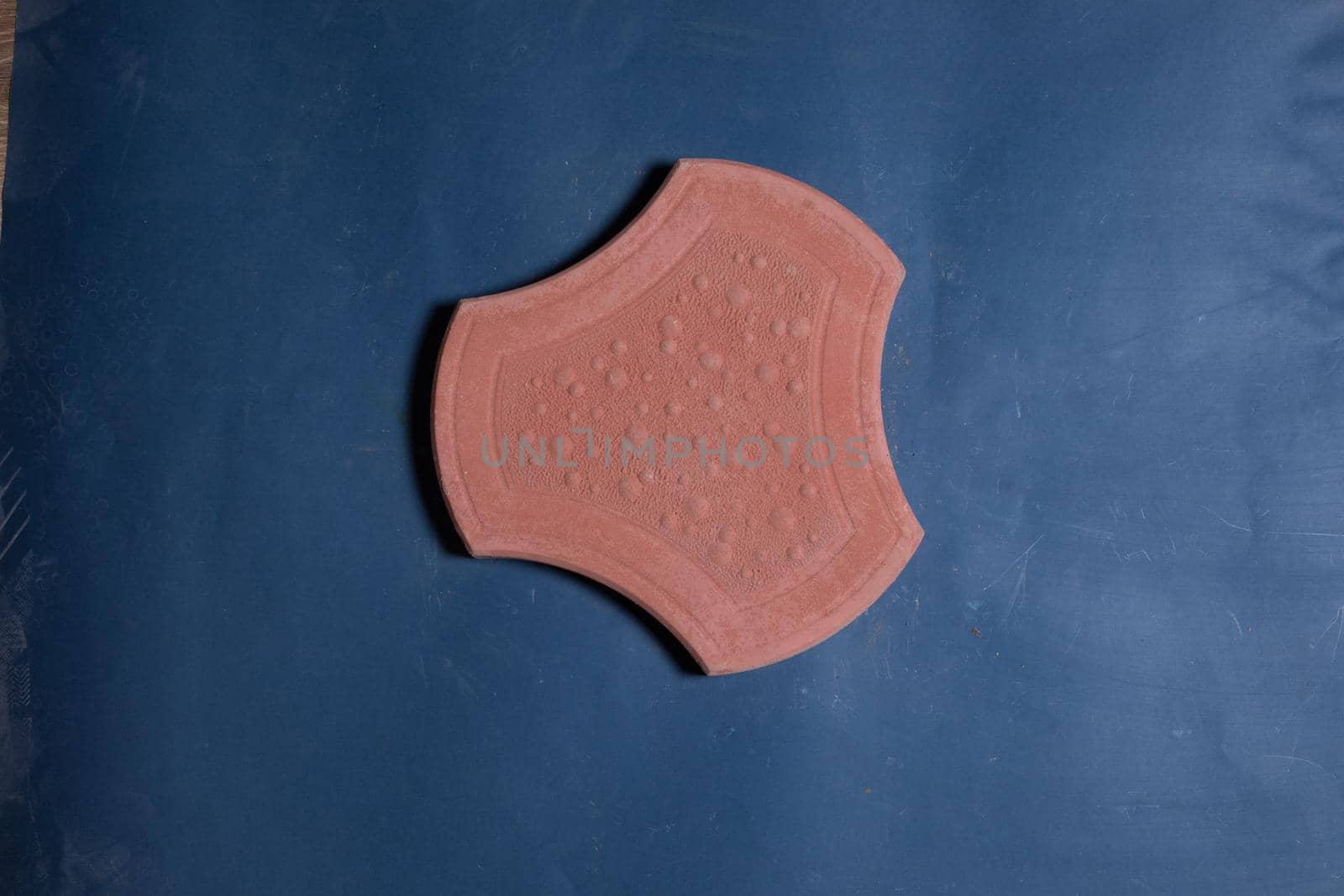 A sample of ground, wall stone shape on the unicolour background