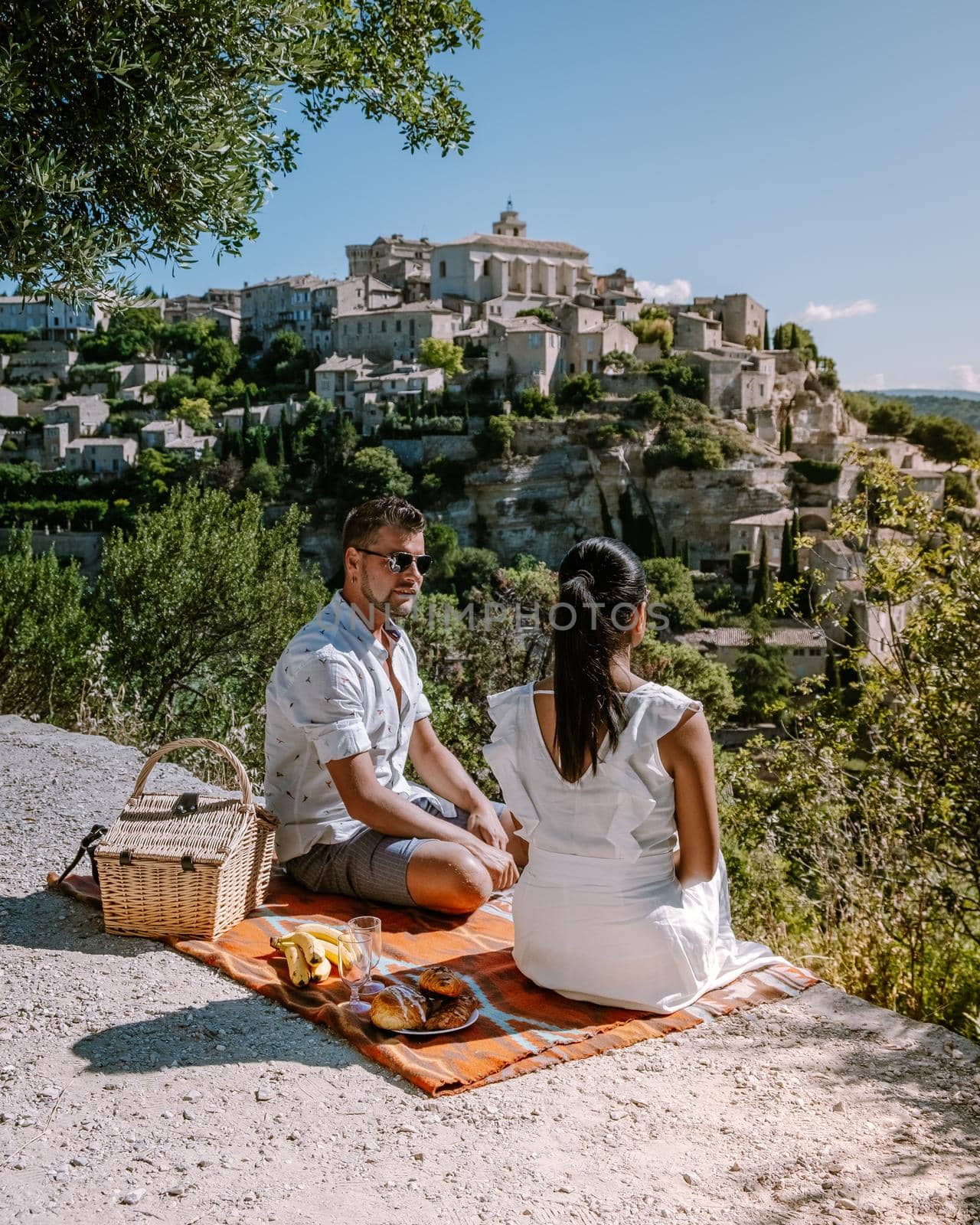 couple visit the old town of Gordes Provence,Blooming purple lavender fields at Senanque monastery, Provence, southern France by fokkebok