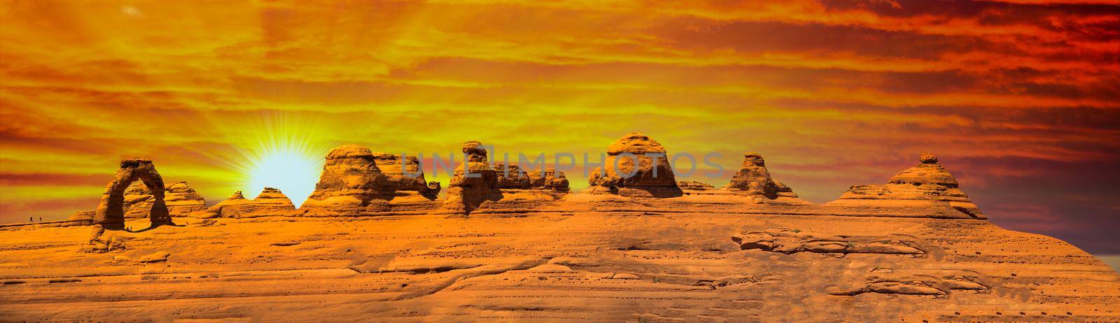 Delicate Arch panoramic view, Arches National Park. High resolution image of rock formations at sunset by jovannig